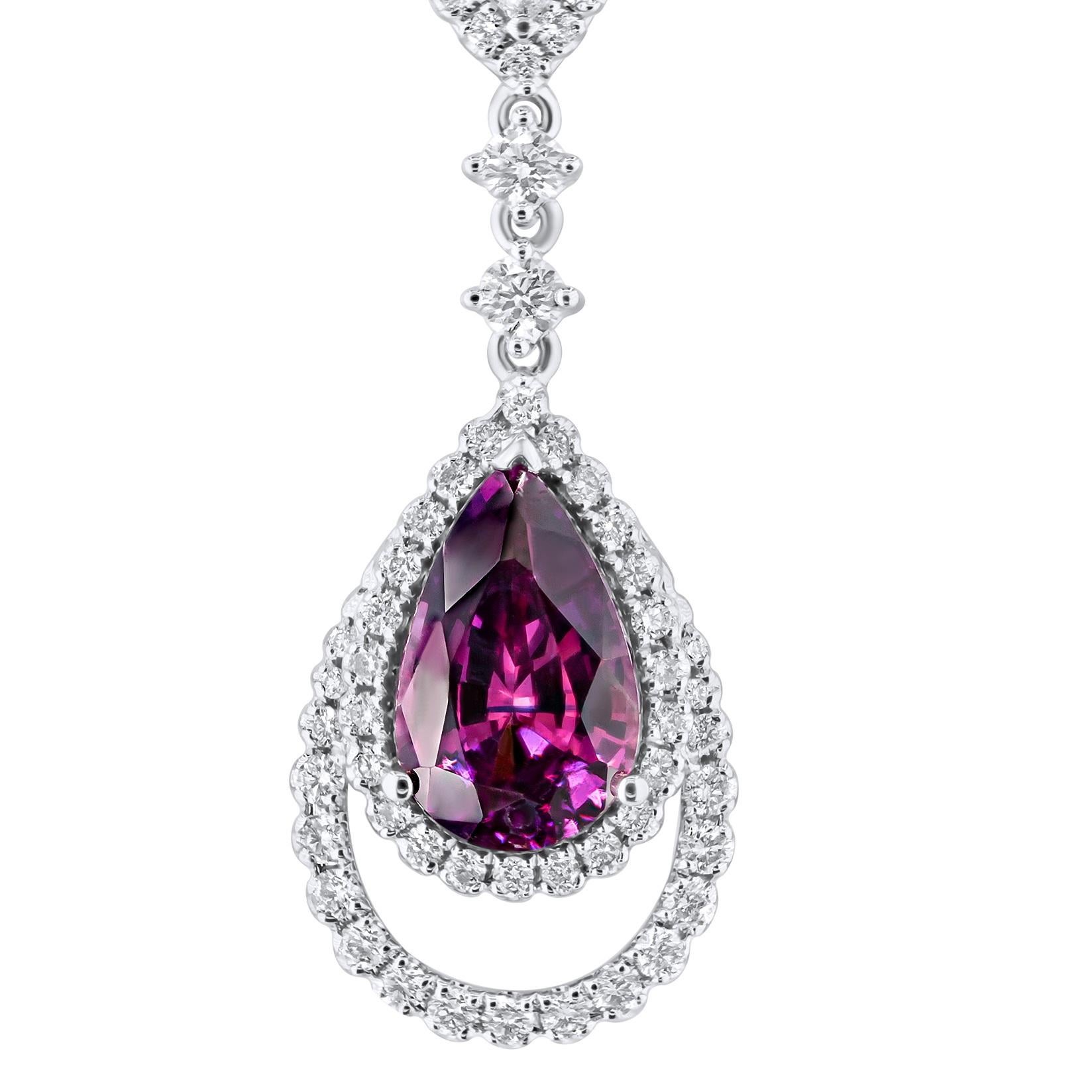 This exquisite pendant showcases a 1.72 carat pear-shaped rose pink sapphire, elegantly encircled by a halo of round diamonds and nested within an additional frame of round white diamonds. An elegant suspended design is created with the inclusion of