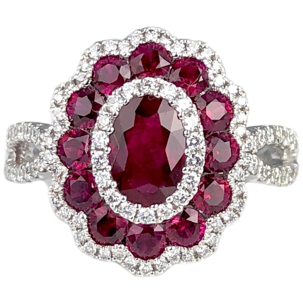 (DiamondTown) This beautiful ring features one oval cut Ruby center, surrounded by alternating halos of round white diamonds and round rubies. Additional round diamonds down the split shank complete the look (total diamond weight 0.44 carats).

Many