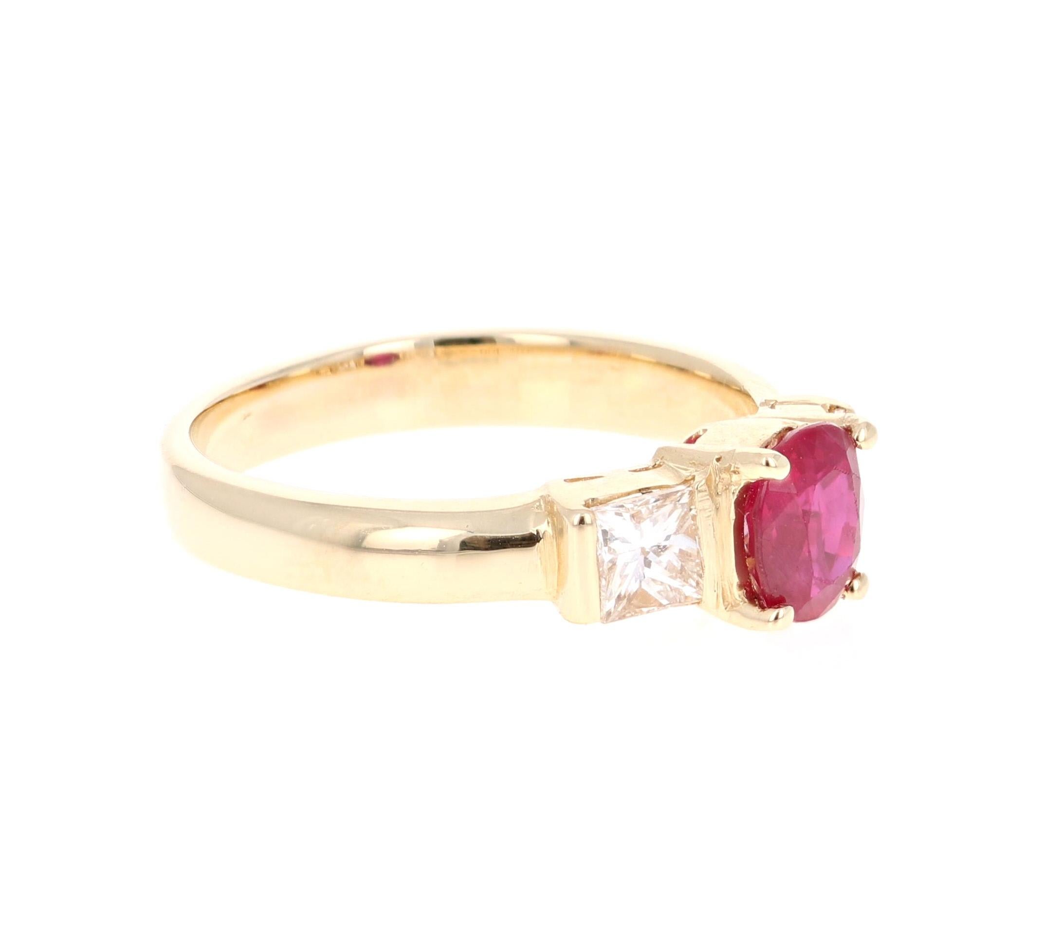 Simply beautiful 3-Stone Ruby Diamond Ring with a Oval Cut 1.08 Carat Ruby which is surrounded by 2 Princess Cut Diamonds that weigh 0.64 carats. The total carat weight of the ring is 1.72 carats. The clarity and color of the diamonds are VS-H.

The