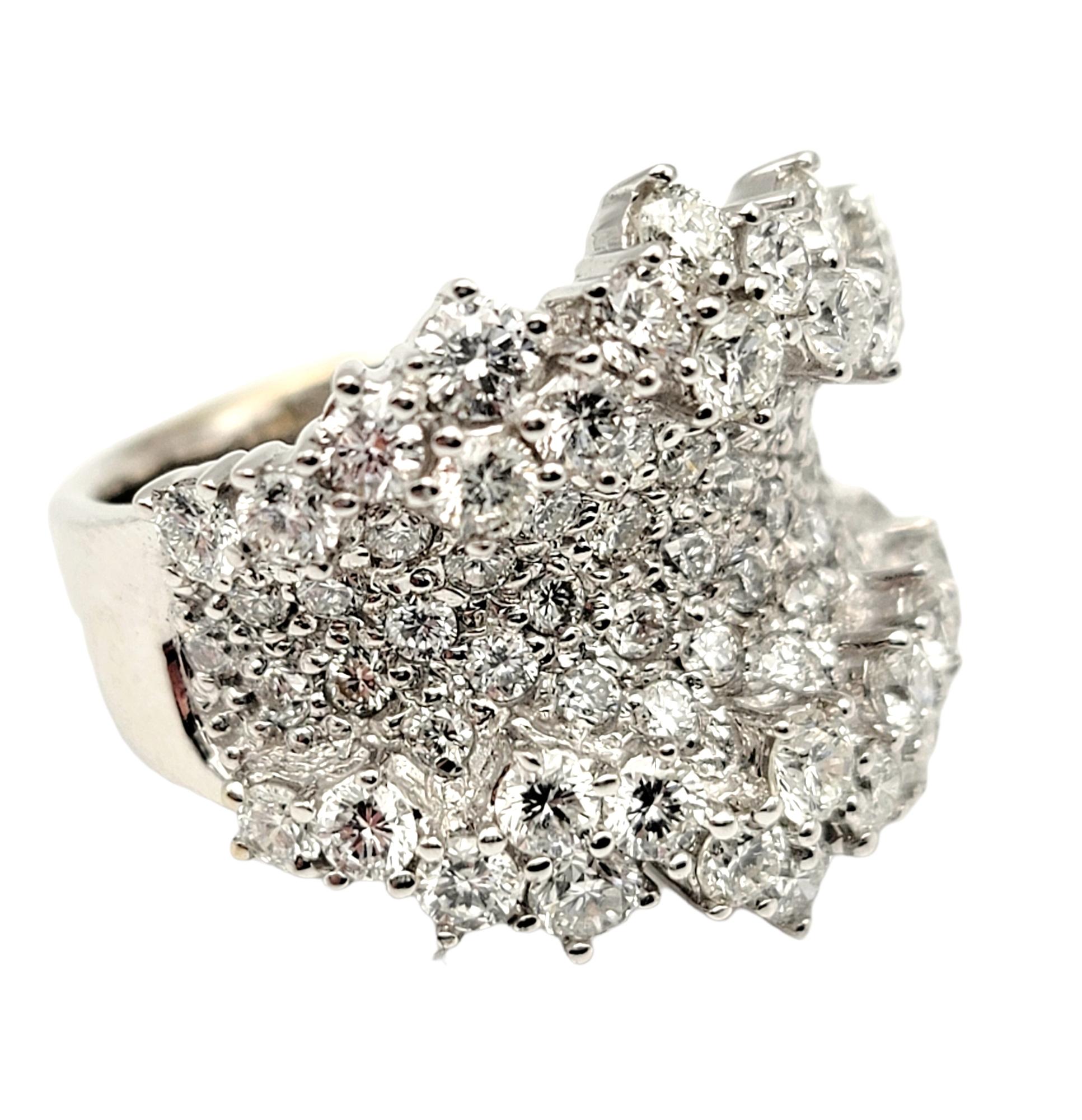 Ring size: 5

This glittering diamond ring is an absolute show stopper. Bright, icy white round diamonds shimmer and shine brilliantly throughout the entire piece, while the polished white gold enhances their white brilliance. The unique textured