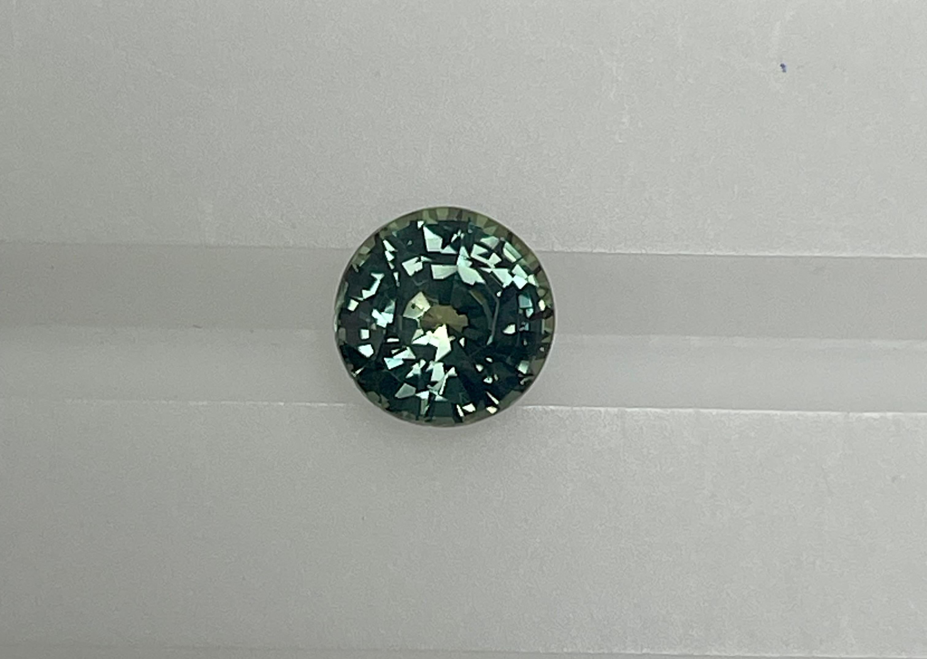 This 1.72 Ct Round shape sapphire exhibits great mix of blue and green color which is referred to as Teal color . The round shape and the color and quality of this stone makes it very unique and very much in demand.
