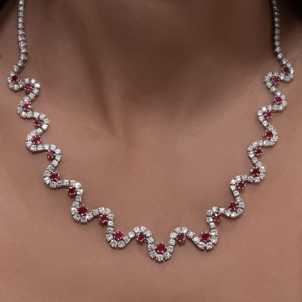 This stunning Platinum necklace is handset with 17.20 carats of round brilliant diamonds and 4.25 carats of all natural rubies. All the diamonds are F/G Color and VS Clarity.
17.25