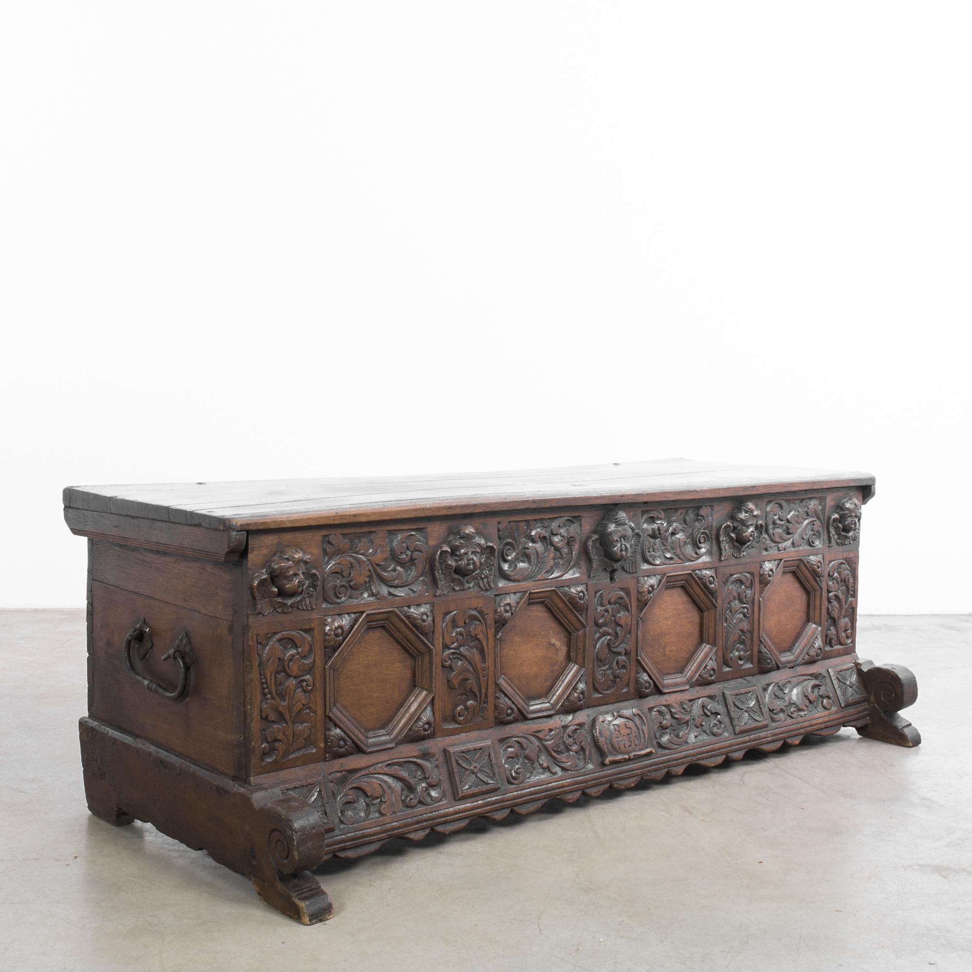 Step into the historical elegance of the 1720s with the German Wooden Trunk, a fine example of continental craftsmanship. This exquisitely carved oak coffer from Germany boasts a beautifully carved arcaded front, retaining its original lock and key,