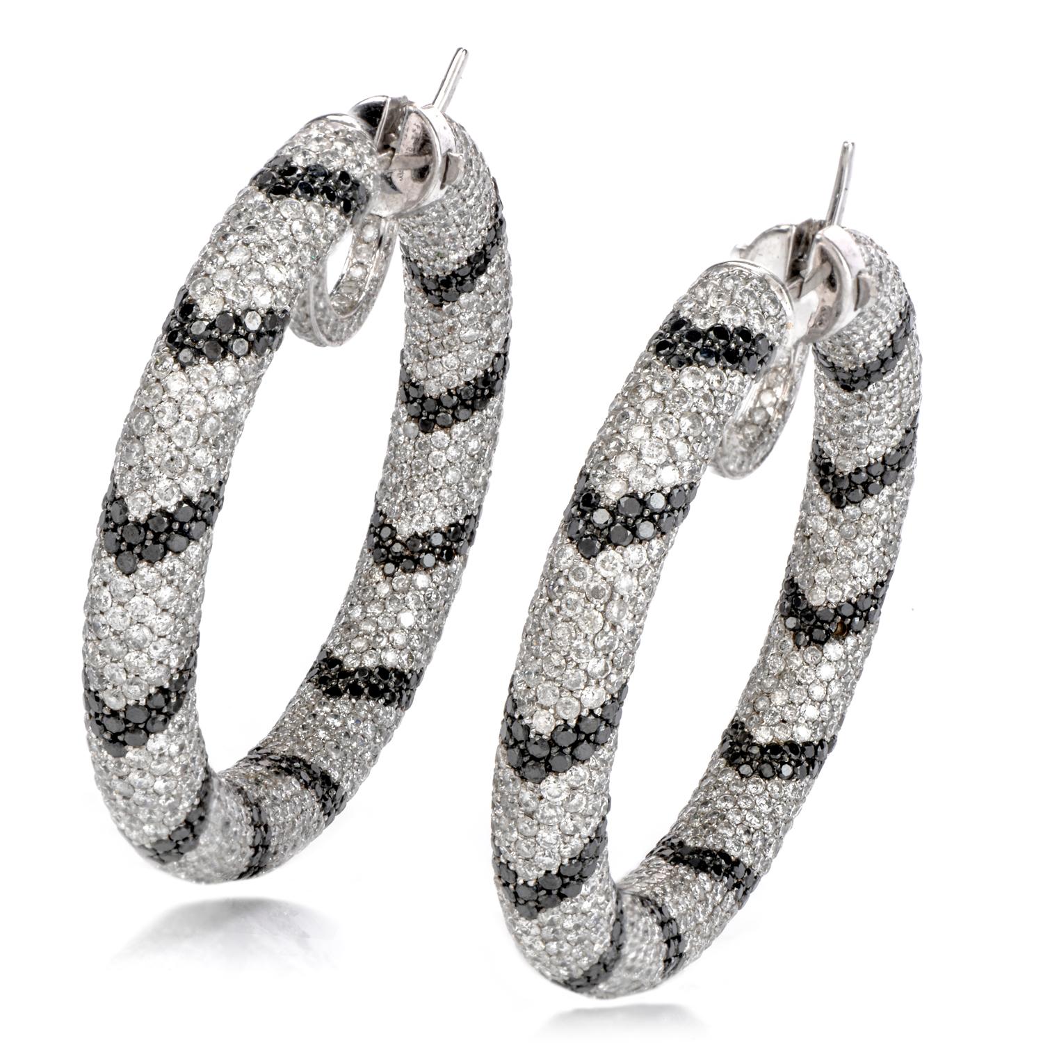 Give your style a twist with these special and unique 17.21 Carat Black & White Diamond 14K Gold Stripe Hoop Earrings.  The black and white diamonds are complemented by the bright 14K white gold hoop settings.  The diamonds form chevron alternating
