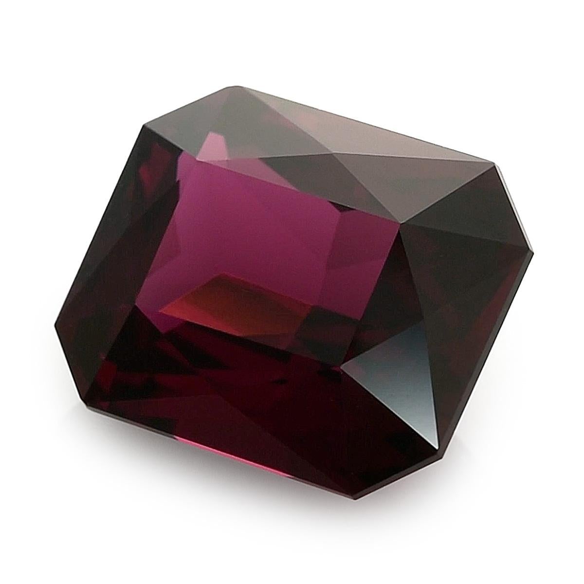 Introducing a stunning Natural Garnet with a carat weight of 17.21 carats, shaped in an elegant Emerald cut. The gem showcases precise measurements of 15.89 x 12.87 x 8.35 mm, featuring a Brilliant/Step cut that enhances its brilliance. The