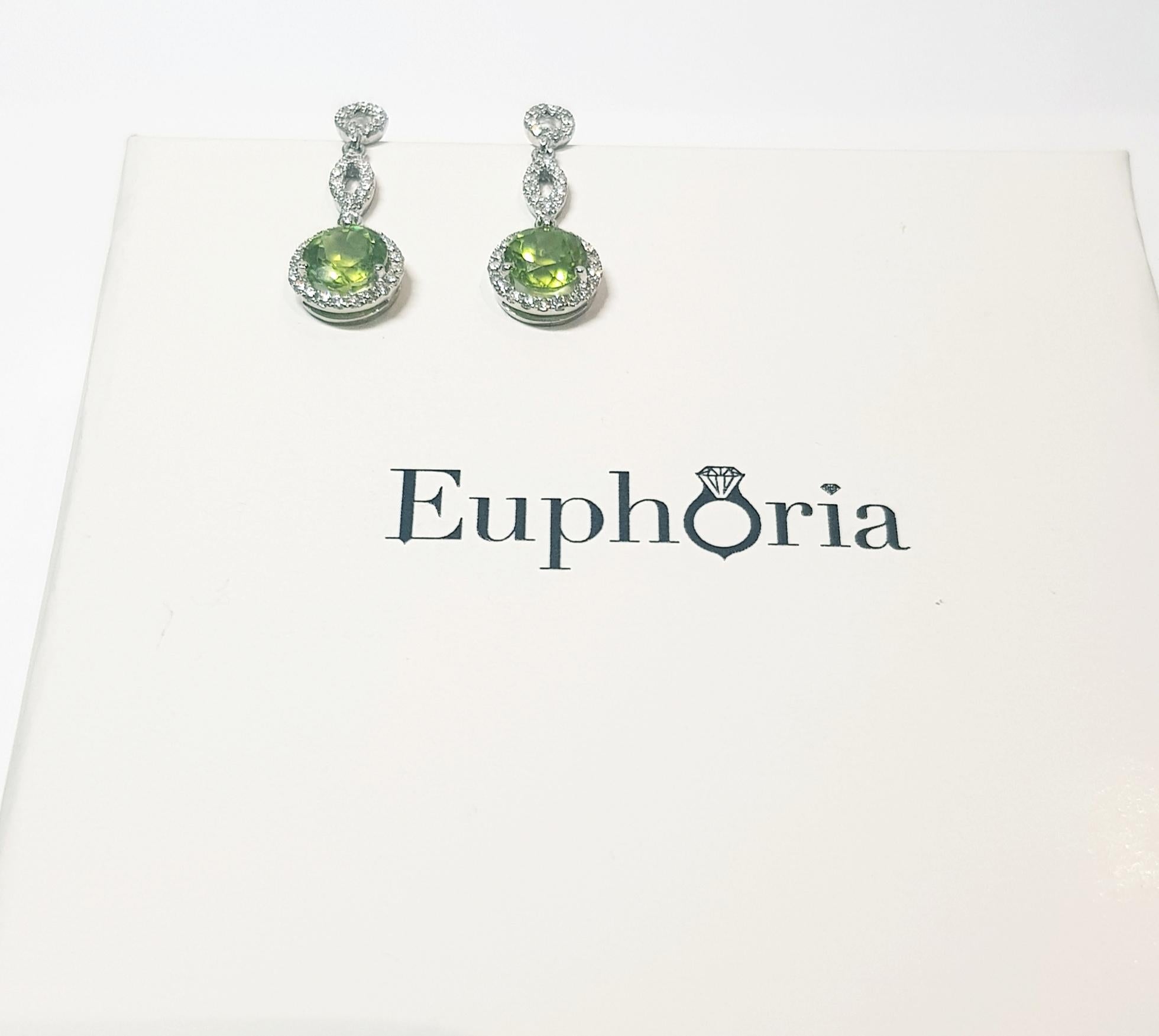 Beautiful and naturally captivating ,these elegant Peridot and diamond drop earrings are a unique bespoke Euphoria design. 
The Peridot is the traditionally classic August birthstone and a wonderful gift for people celebrating their 16th wedding
