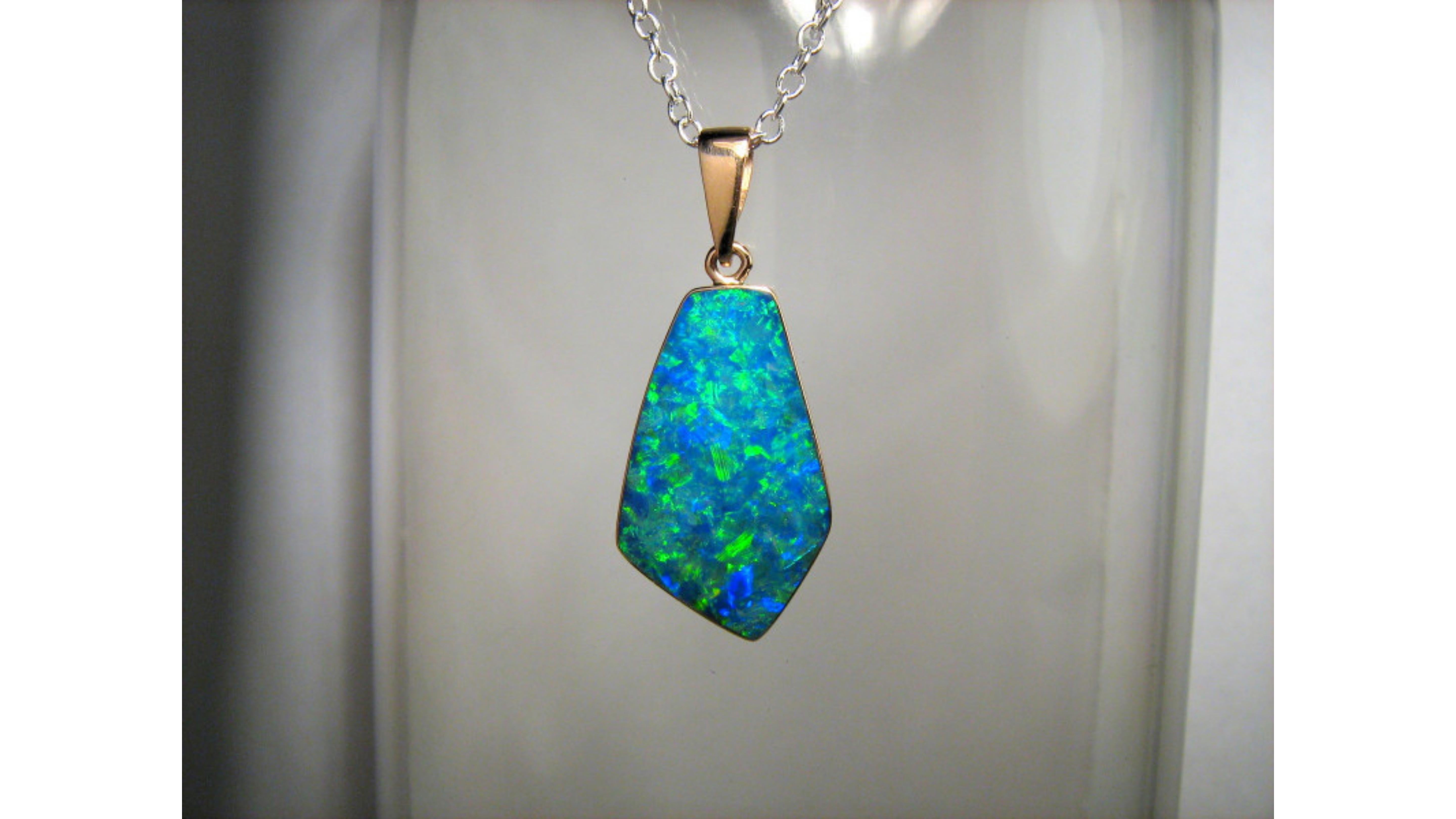 7.2 Carat  Australian Opal Necklace Sterling Silver  . This shows off bright colors  Blue Green Yellow  and comes from Coober Pedy South Australia .    If you are looking for anything specific  let us know  as we might have or can have it made.