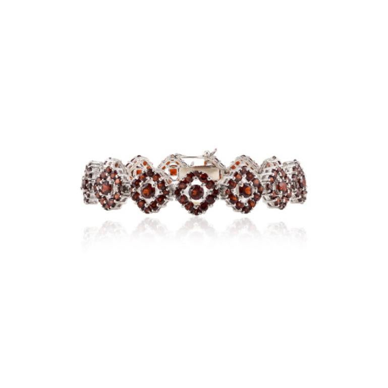 17.25 CTW Garnet January Birthstone Wedding Bracelet in sterling silver showcases endlessly sparkling natural garnet, weighing 17.25 carat. It measures 7 inches long in length. 
Garnet stimulate concentration and reduces stress. 
Designed with