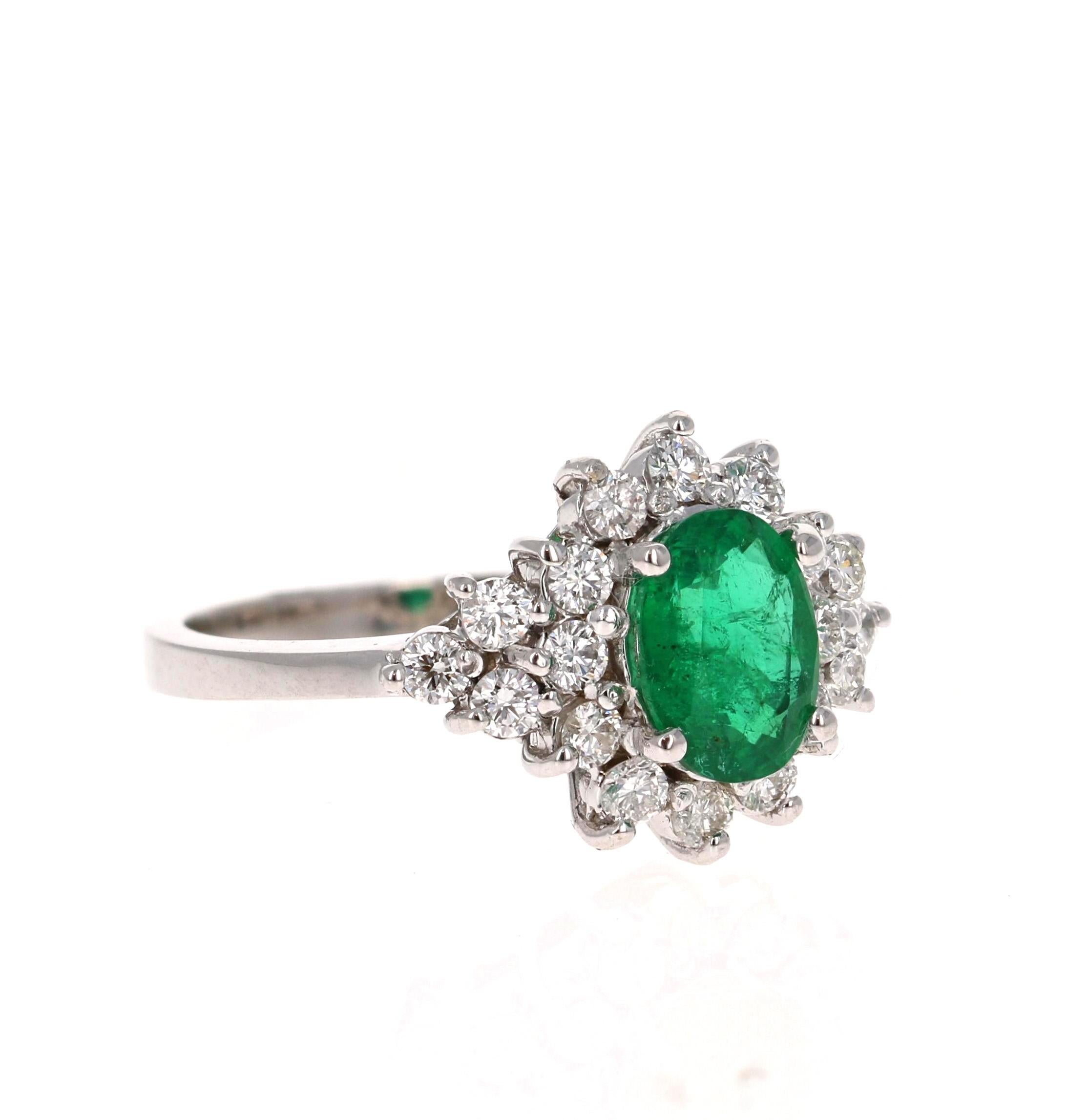 A beautiful 1.73 Carat Emerald and Diamond Ring in 18K White Gold.
This gorgeous ring has a 1.14 Carat Oval Cut Emerald that is set in the center of the ring!  The Emerald is surrounded by 18 Round Cut Diamonds that weigh 0.59 Carats. The Clarity is