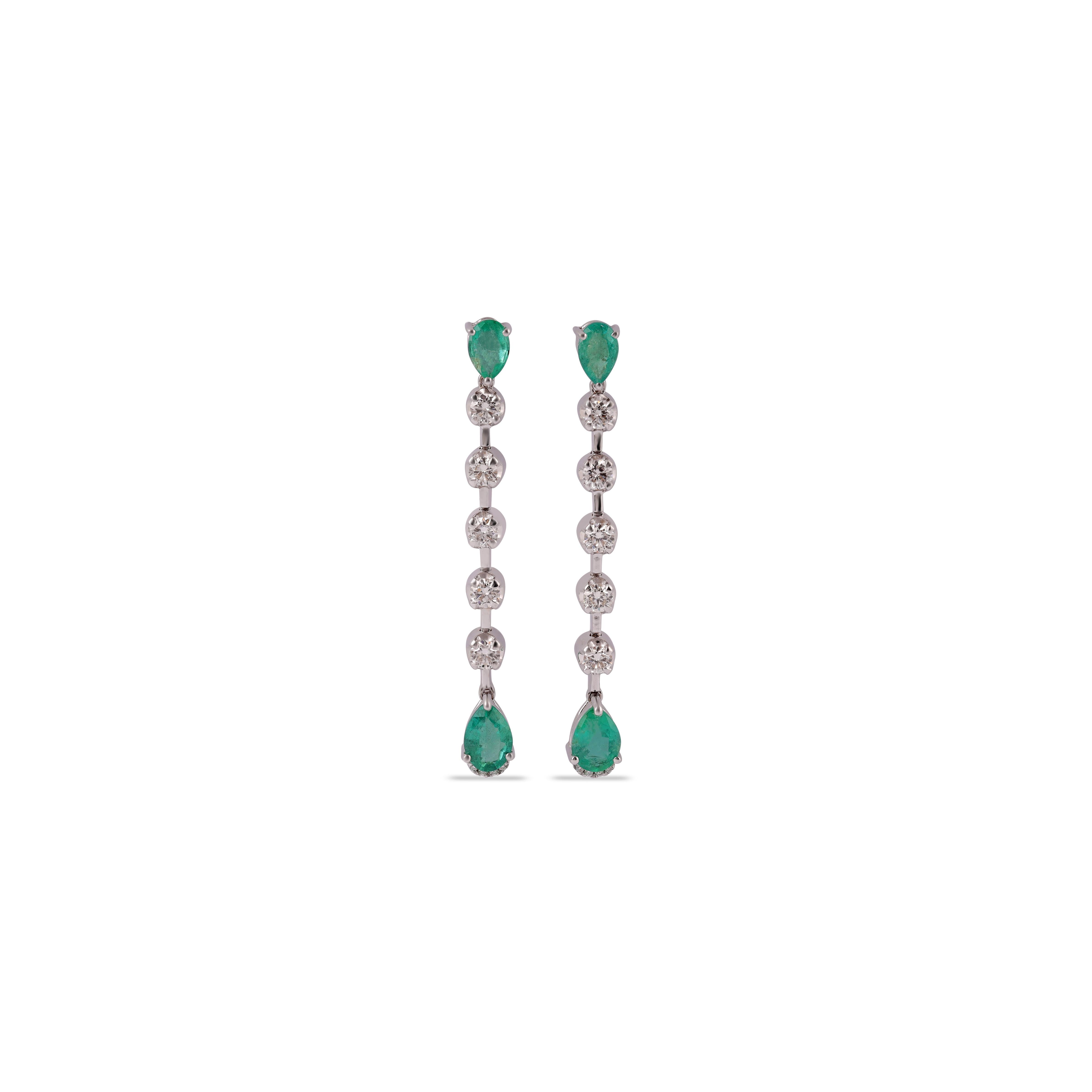 Magnificent  Emerald Mix Shape  Emerald long drop Earrings In 18K Yellow & White 
 4 Emerald - 1.73 Carat
18 Karat White Gold.
18 Brilliant Round Cut Diamond 0.92 Carat
