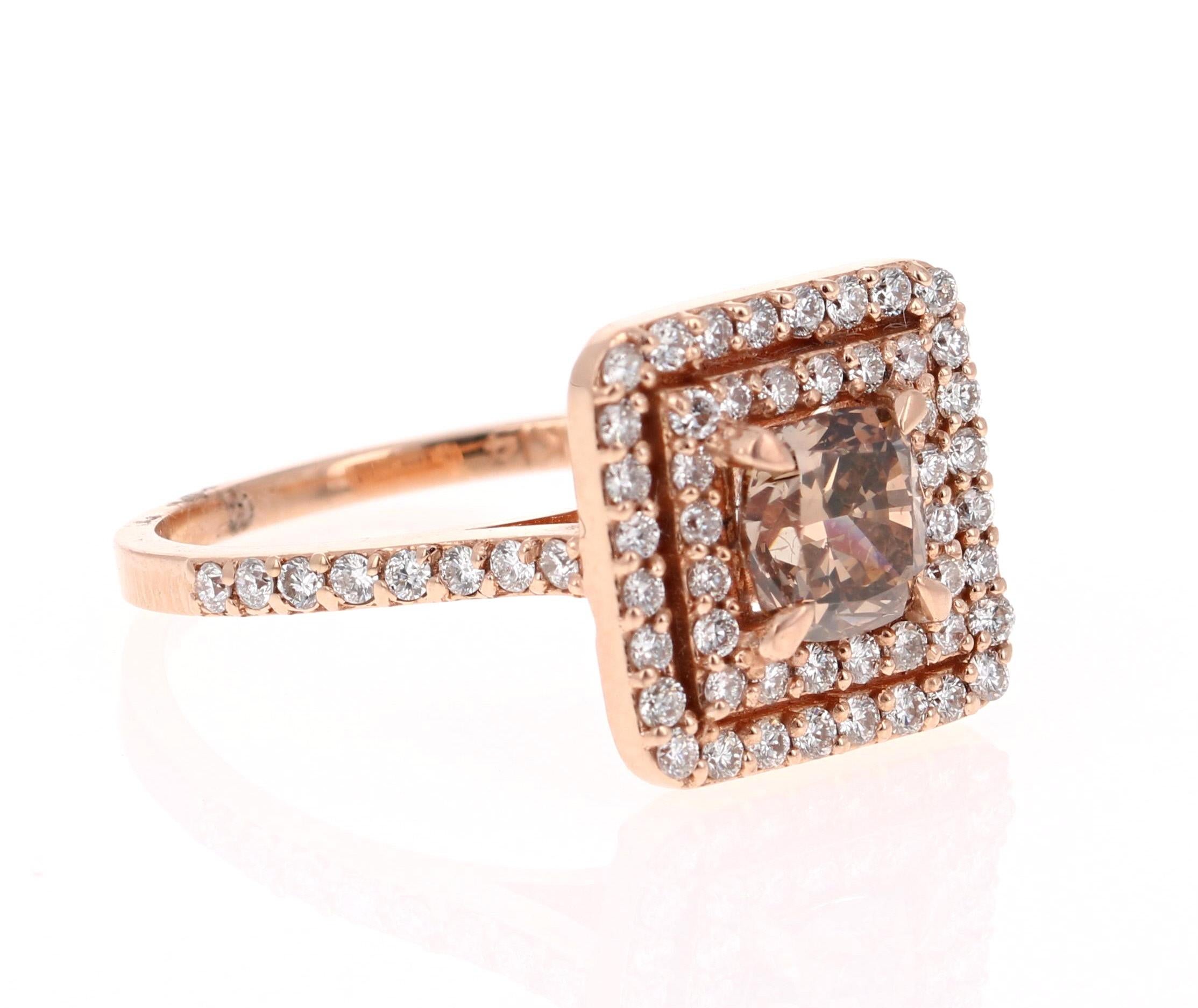 Stunningly Unique and Bold!

This beauty has a Champagne colored natural Cushion Cut Diamond that weighs 1.11 Carats. There is a double halo of 64 Round Cut Diamonds that weigh 0.62 Carats. The total carat weight of the ring is 1.73 Carats. 

The