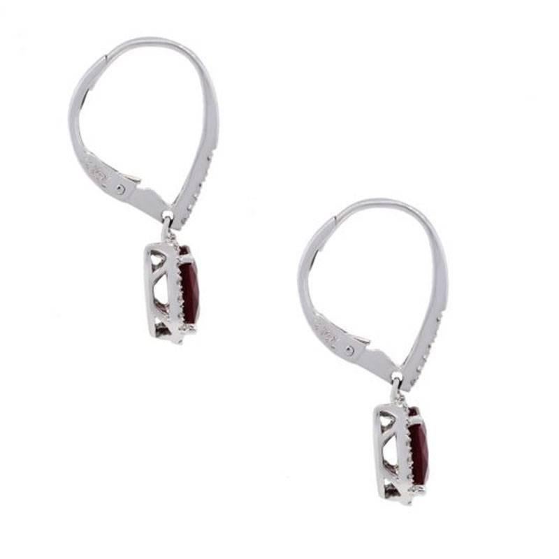 Style: Ruby and diamond dangle earrings
Material: 14k white gold
Gemstone Details: Approximately 1.73ctw ruby gemstones
Diamond Details: Approximately 0.19ctw of Round brilliant diamonds, diamonds are G/H in color and SI in clarity.
Earring