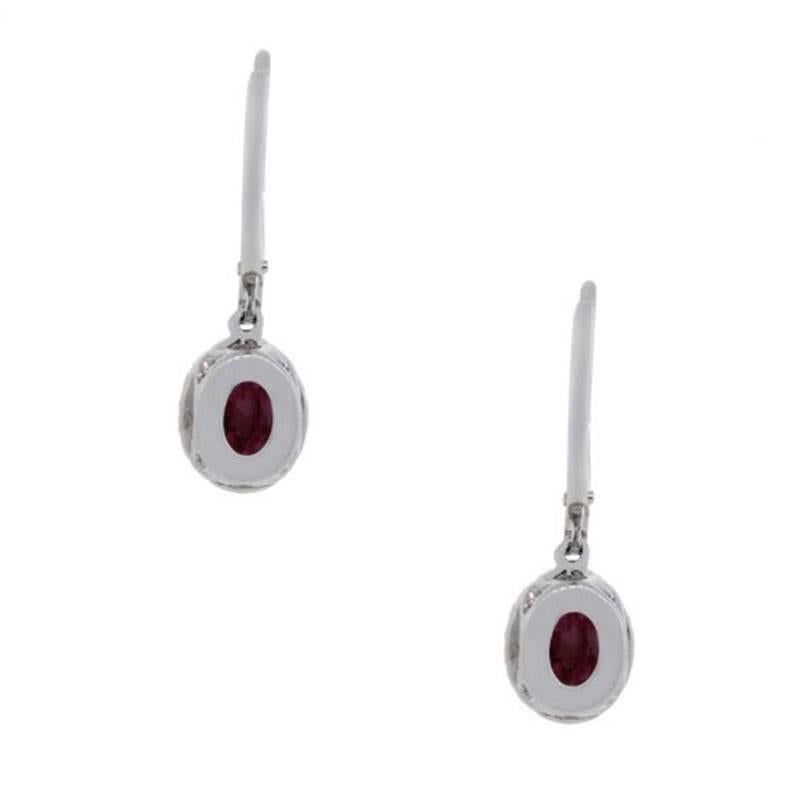 Oval Cut Ruby and Diamond Halo Dangle Earrings