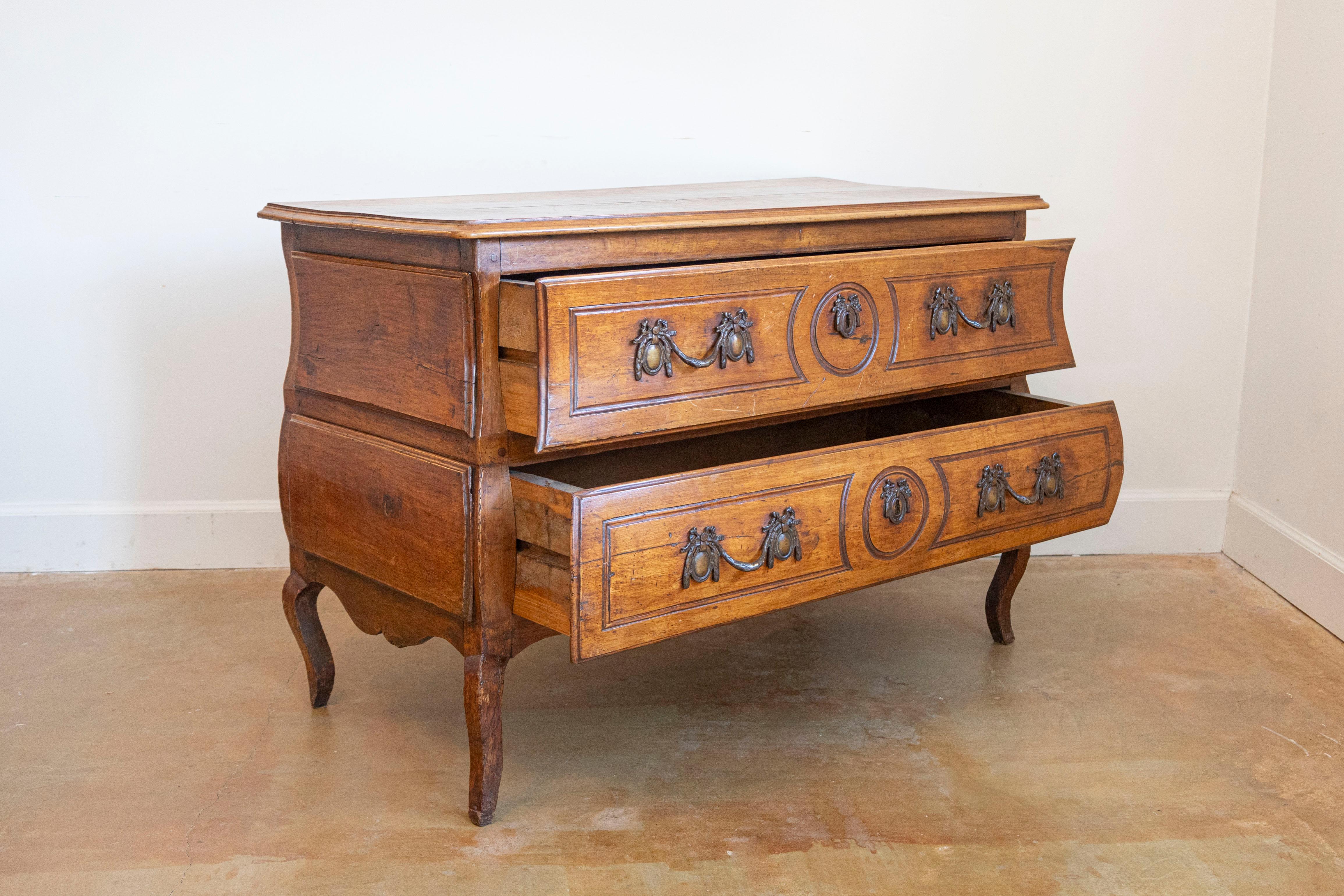 Intagliato 1730s French Period Louis XV Walnut Two-Drawer Commode with Bombé Side Panels in vendita