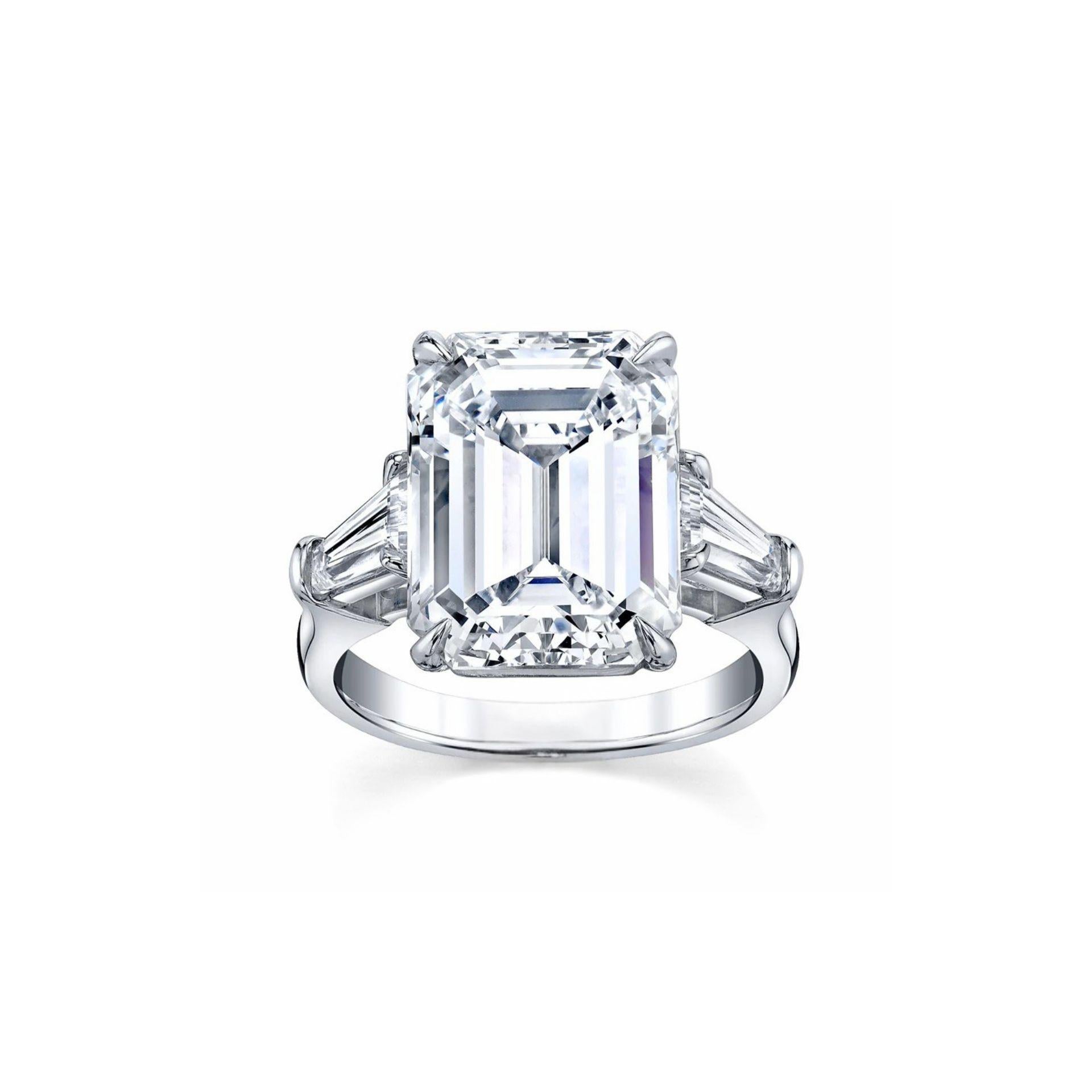 This 17.32-carat emerald-cut diamond ring is a stunning representation of timeless sophistication and expert craftsmanship. The centerpiece is a D-color diamond, the highest grade for colorless diamonds, and boasts a Flawless clarity grade, ensuring