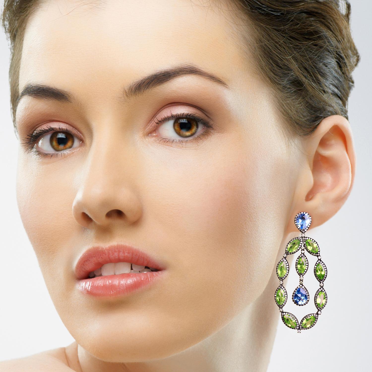 Handcrafted from 14-karat gold and sterling silver, these beautiful earrings are set with 8.3 carats topaz, 17.37 carats peridot and 4.03 carats glimmering diamonds.

FOLLOW  MEGHNA JEWELS storefront to view the latest collection & exclusive pieces.