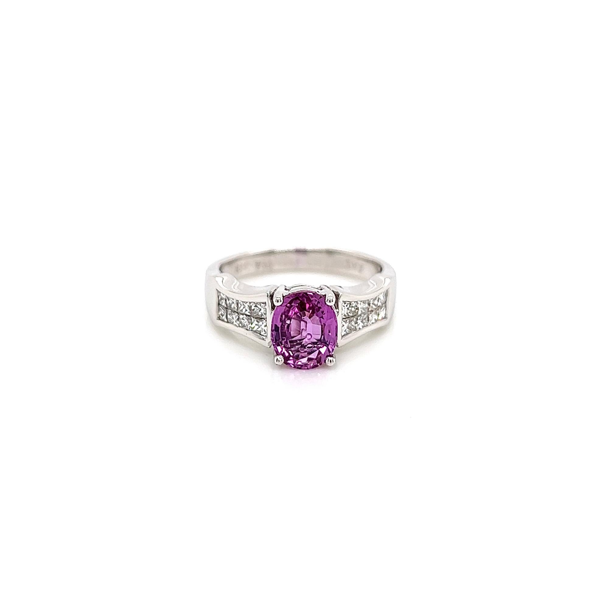 2.33 Total Carat Pink Sapphire Diamond Ladies Ring

-Metal Type: 18K White Gold 
-1.73 Carat Oval Cut Pink Sapphire 
-0.60 Carat Princess Cut Invisible Set Side Natural Diamonds, G-H Color, VS Clarity
-Size 6.75

Made in New York City.