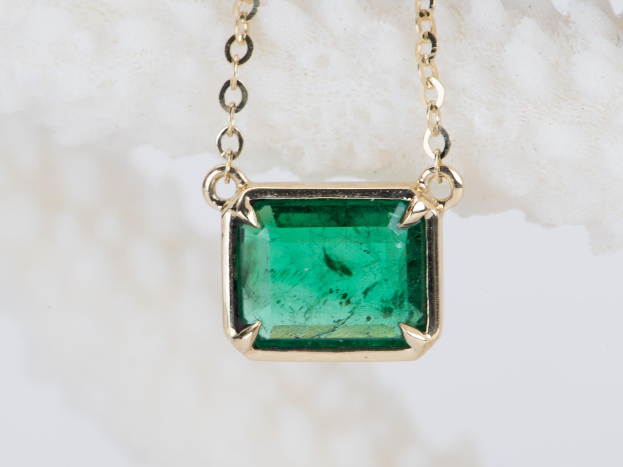 ♥ This beautiful necklace features a stunning Zambian emerald bezel set horizontally, connected to a solid gold chain with a slider bead for free adjustment.
♥ The necklace is 18
