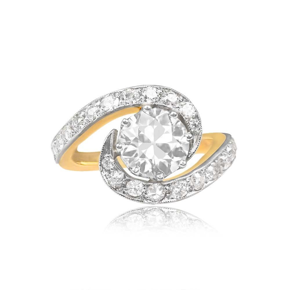 Striking swirl ring featuring a central, prong-set old European cut diamond weighing approximately 1.73 carats (J color, VS2 clarity). The center diamond is encircled by a ribbon motif halo, pave-set with additional old European cut diamonds, and