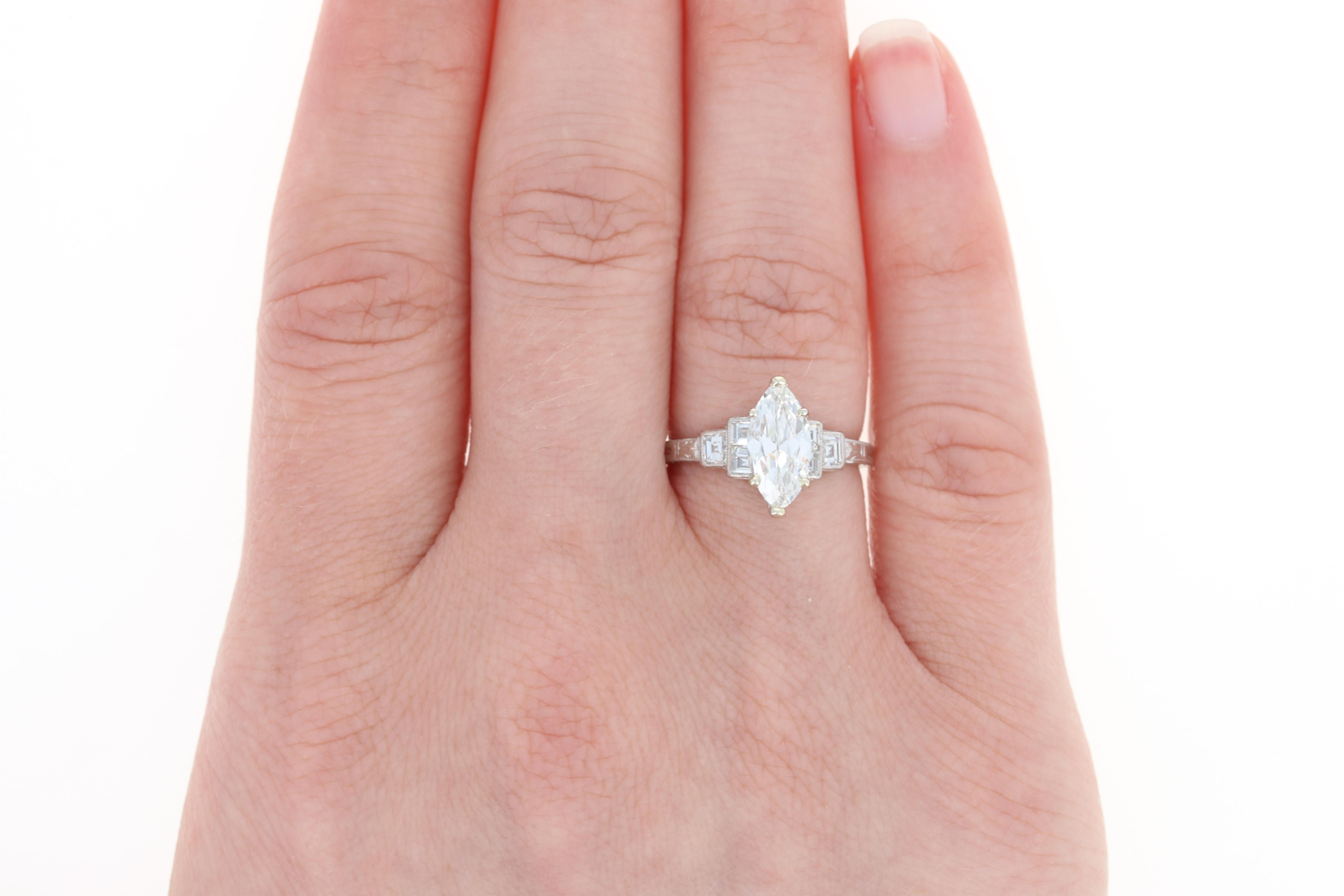A visual symphony of ethereal beauty is captured in this breathtaking Art Deco creation. Exquisitely crafted in the 1920s - 1930s, this vintage ring showcases a GIA-graded diamond solitaire accompanied by six accent diamonds which are held in a