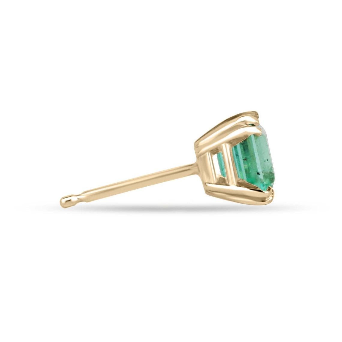 Indulge in the mesmerizing beauty of Colombian emeralds with our stunning stud earrings, featuring two natural asscher-cut gems. Radiating a bright, vivid electric green hue and boasting remarkable eye clarity, these captivating emeralds are