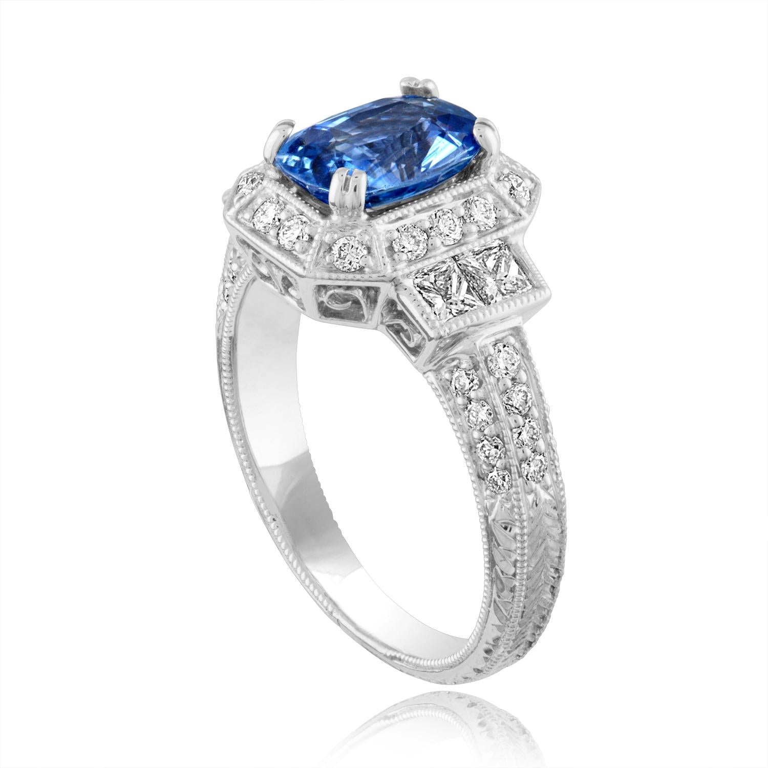 Beautiful Art Deco Revival Oval Cut Milgrain Filigree Ring
The ring is 14K White Gold
The Center Stone is an Oval Cut Blue Sapphire 1.74 Carats
The Sapphire is Heated
There are 1.00 Carats in Diamonds F/G VS/SI
The ring is a size 6.00, sizable
The