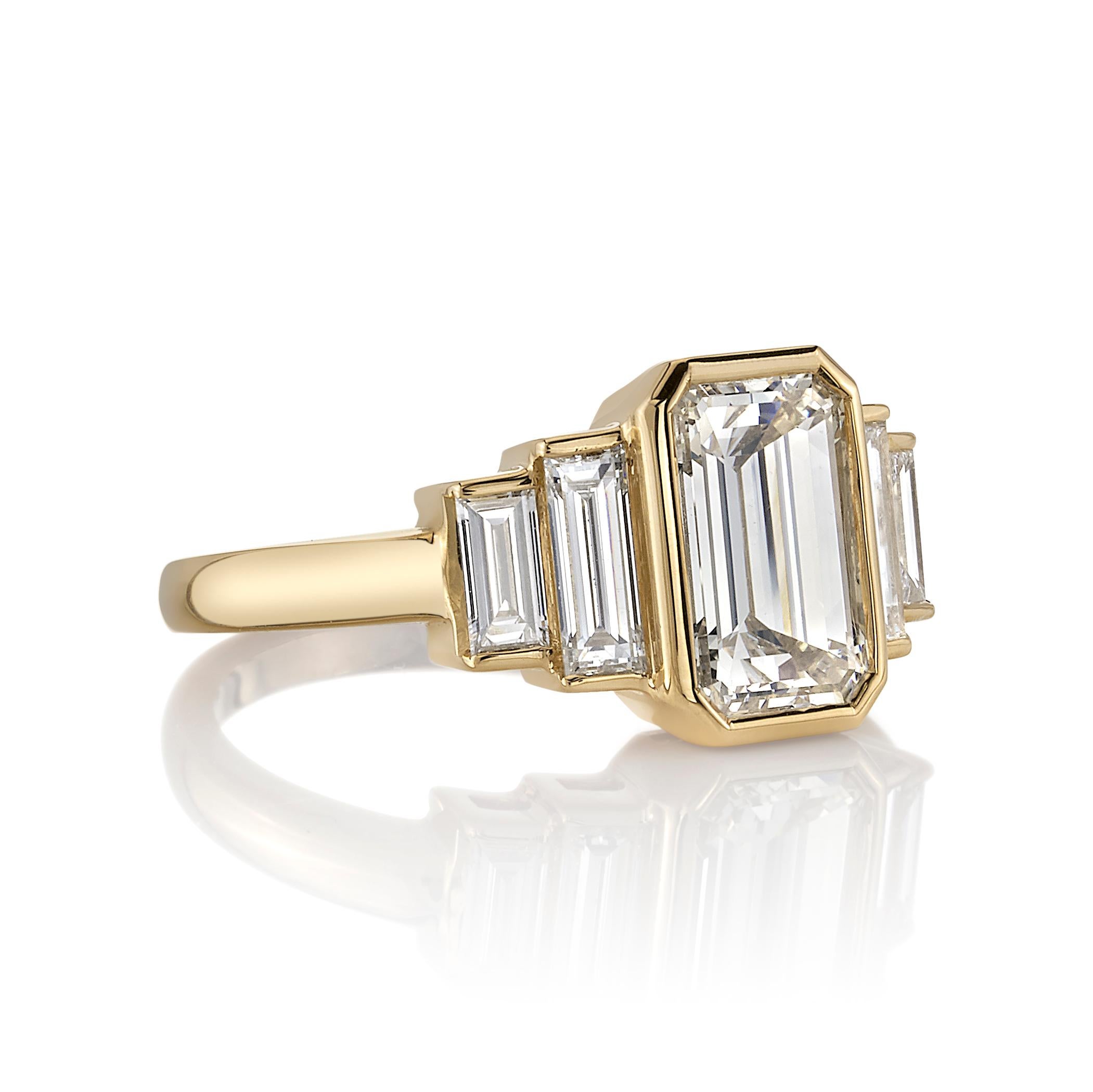 1.74ctw N/VS2 GIA certified Emerald cut diamond set in a handcrafted 18K yellow gold ring.

Ring is currently a size 6 and can be sized to fit.