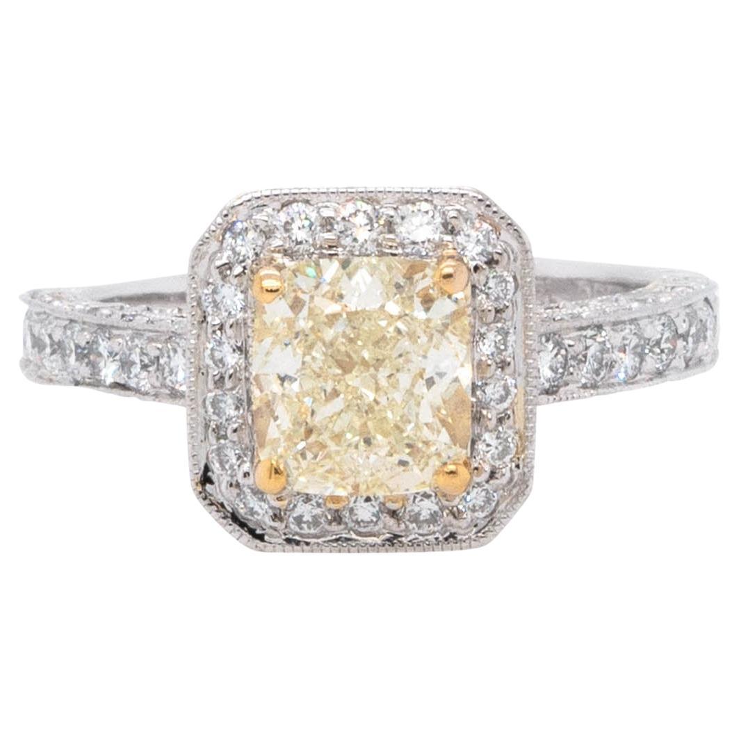 1.74 Carat Natural Cushion Cut Fancy Yellow Diamond Halo Ring For Sale