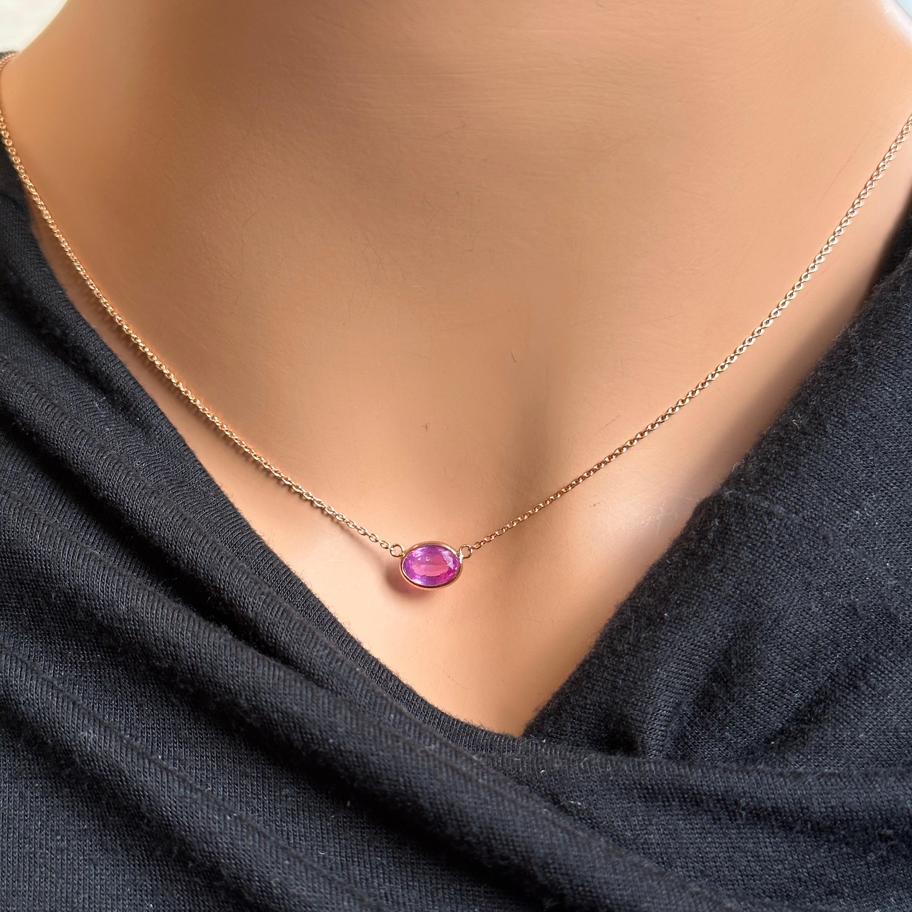 A fashion necklace crafted in 14k rose gold with a main stone of a certified oval-cut pink sapphire weighing 1.74 carats would be a stunning and elegant choice. Pink sapphires are renowned for their delicate and romantic color, and the oval cut adds