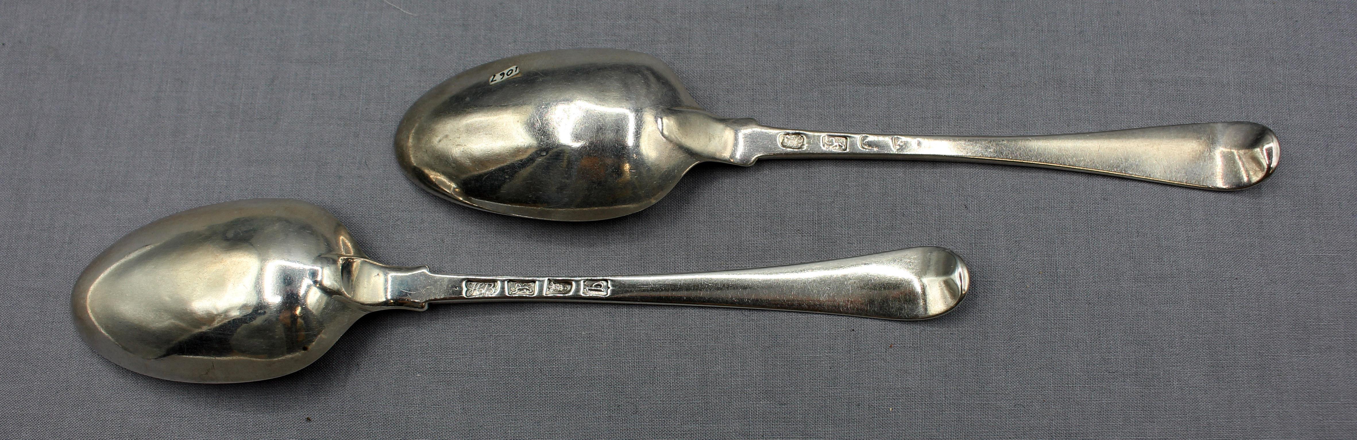 Matched pair of sterling silver tablespoons by Lampfert & Bateman, London, 1740s & 1777. Crested (lion's head erased, assoc. with multiple families); rubbed date mark for the one by John Lampfert. The other by Hester Bateman, 1777, this one is