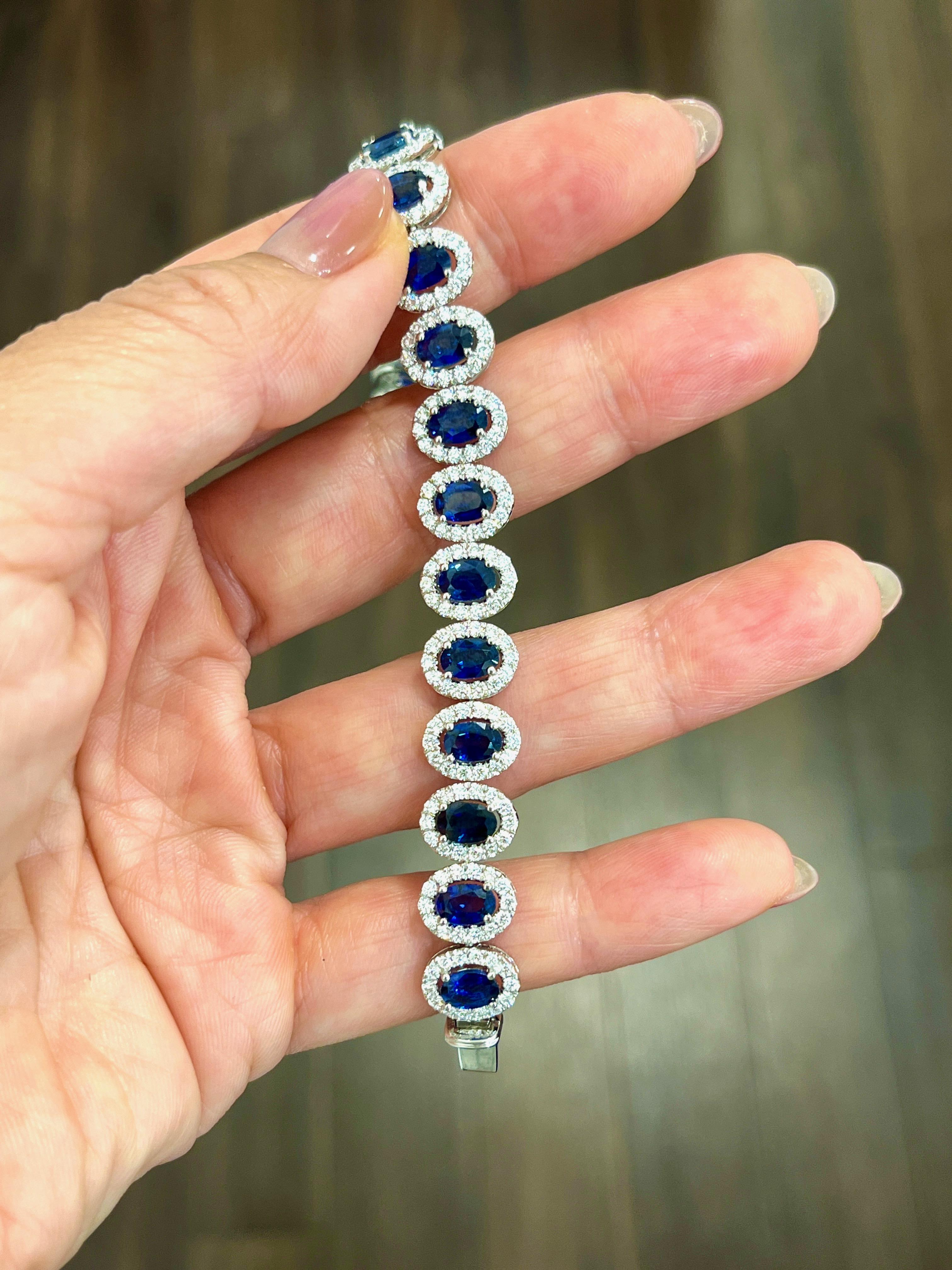 This gorgeous natural sapphire and diamond bracelet boasts 17.48 ctw. Featuring 22 natural sapphires weighing 13.10 ct and 308 diamonds weighing 4.38 ct. The diamonds are E/F in color and VS1/VS2 in clarity. A beautiful addition to any wardrobe. 