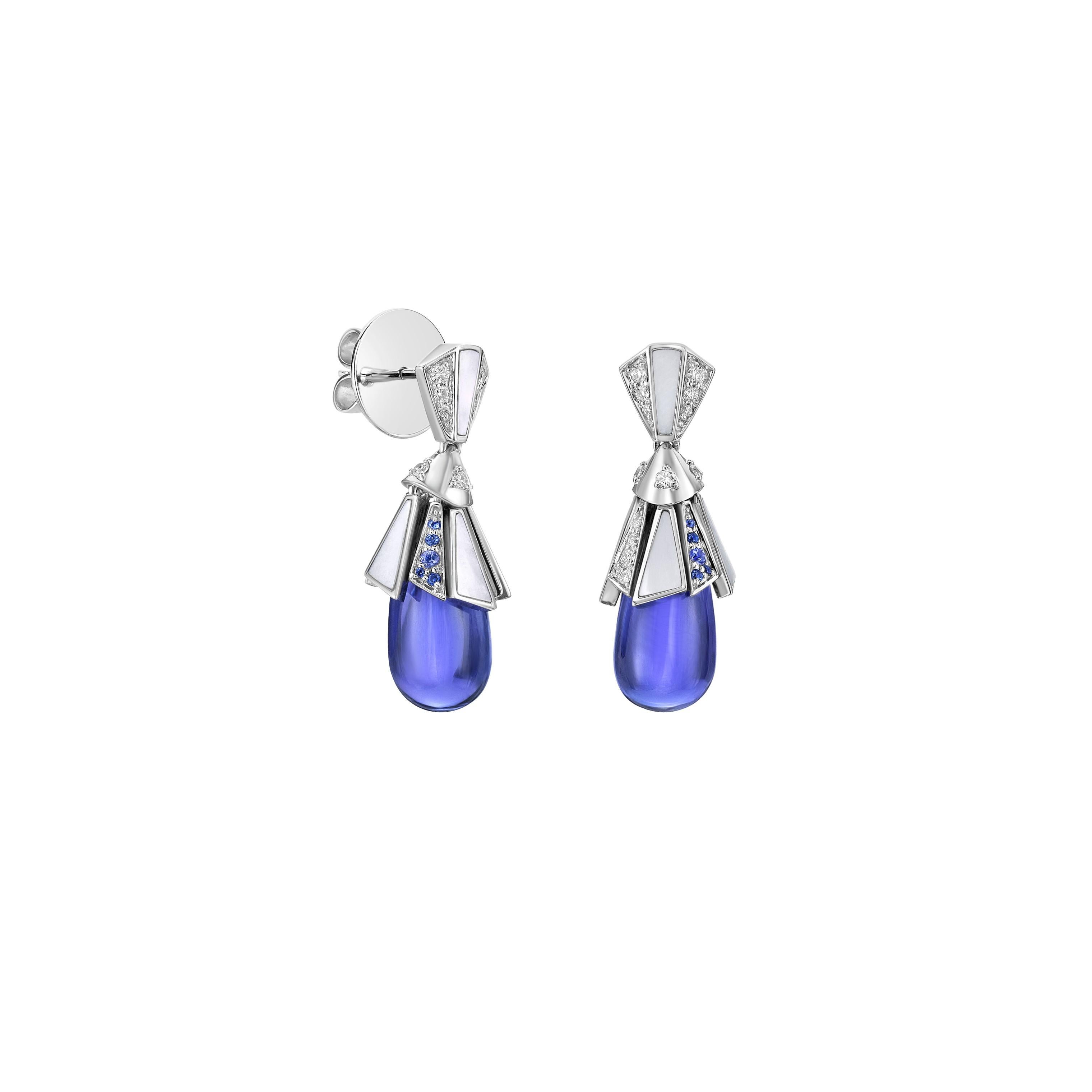 The earrings features a water drop-shaped Tanzanite stone with Tanzanite hue, adorned with mother of pearls. It's made of white gold and studded with blue sapphire, Mother of Pearl and diamonds, making it suitable for any function or special