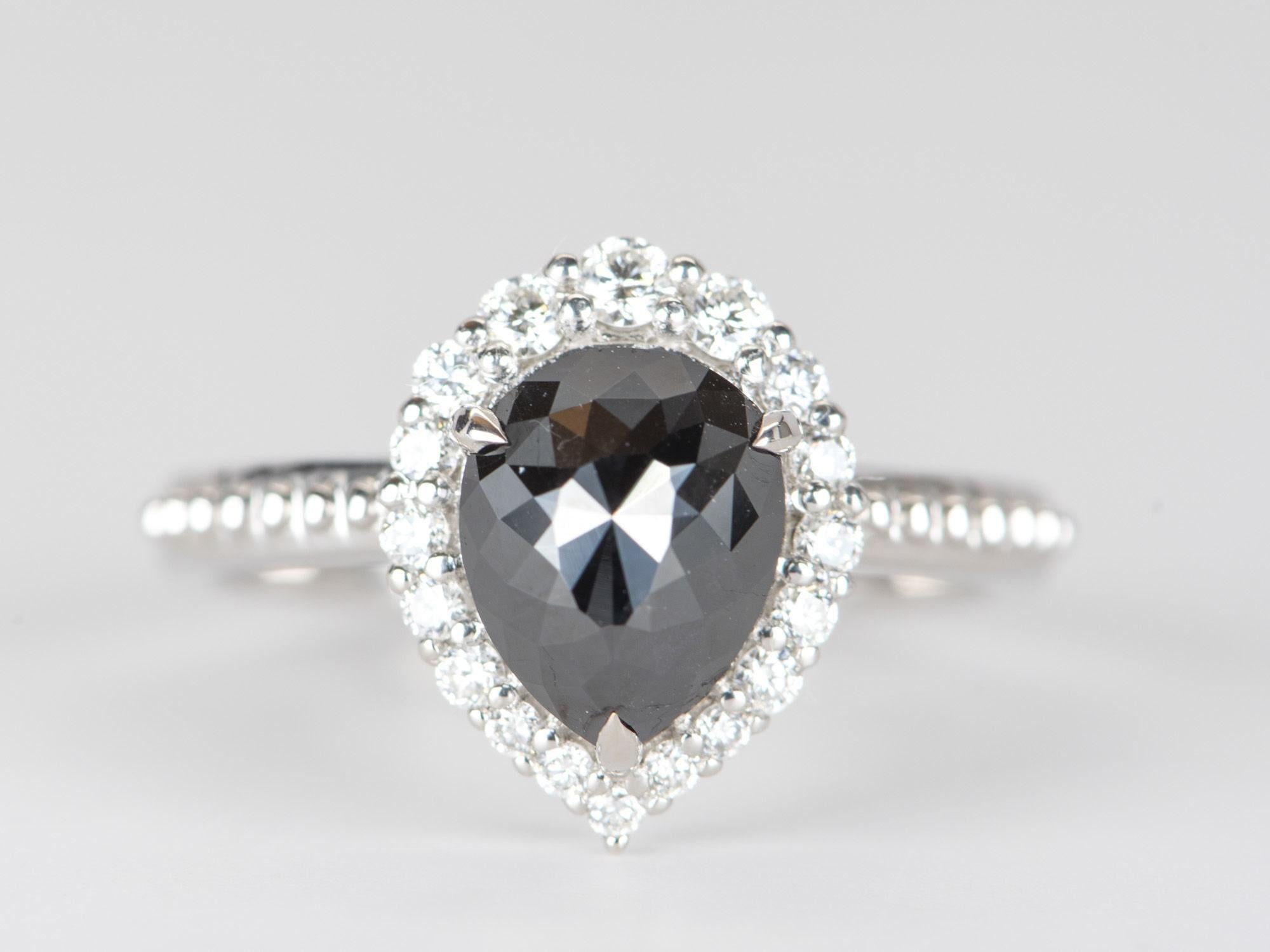 ♥ 1.74ct Black Diamond with Clear Halo 14K White Gold Engagement Ring
♥ Solid 14k white gold ring set with a beautiful pear-shaped diamond
♥ Gorgeous black color!
♥ The item measures 13.3 mm in length, 10.6 mm in width, and stands 7.5 mm from the