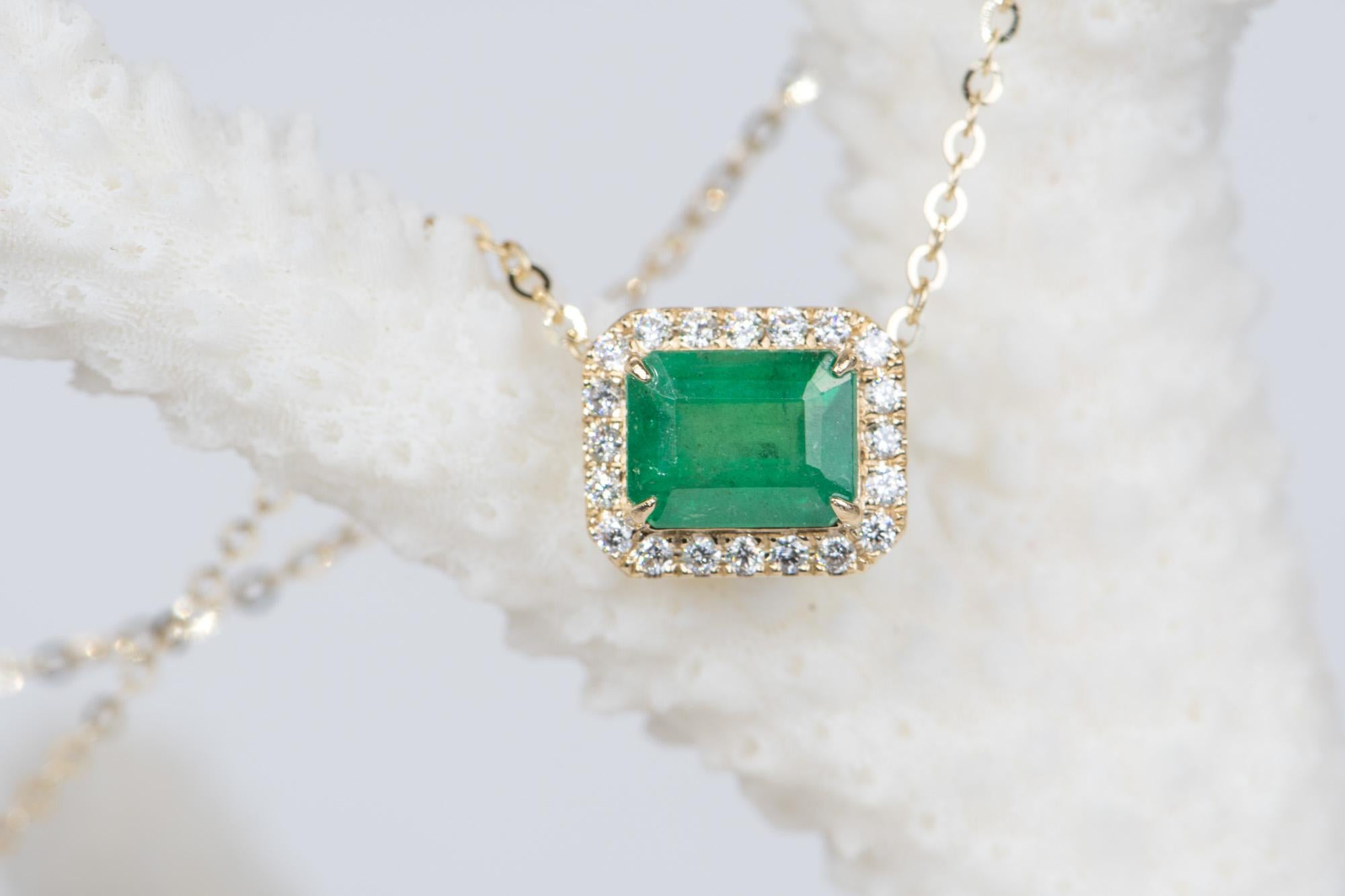 ♥  A solid 14K yellow gold necklace featuring a stunning emerald in the center, flanked by a halo of sparkling diamonds
♥  The overall setting measures 9.05mm in width, 10.8mm in length, and sits 6.9mm tall
♥  This pendant is great for layering or