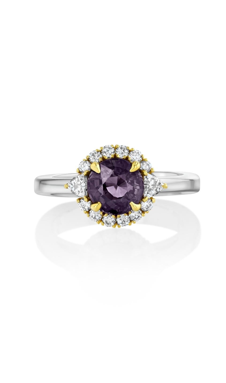 This enchanting 1.74-carat, Alexandrite from India, displays an olive green hue under white light and purplish gray under incandescent light. Framed by two epaulette and 34 round diamonds, the jewels are presented in 18K yellow gold and platinum.