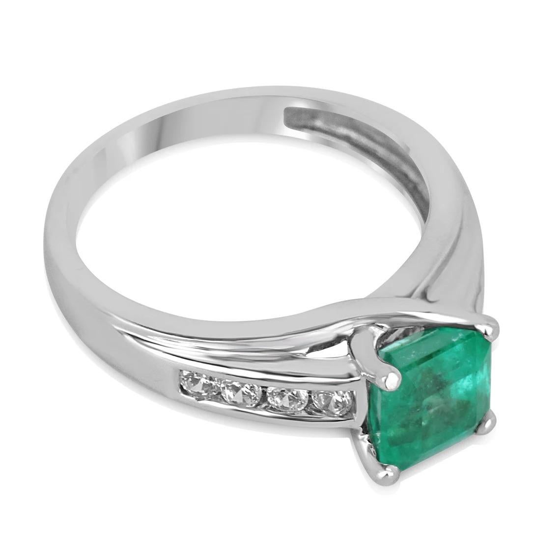 This stunning ring features a 1.74 total carat weight earth-mined emerald as the centerpiece, which is set in 14K white gold. The emerald's bright green color is complemented by the sparkling diamond accents that highlight the shank, adding a touch