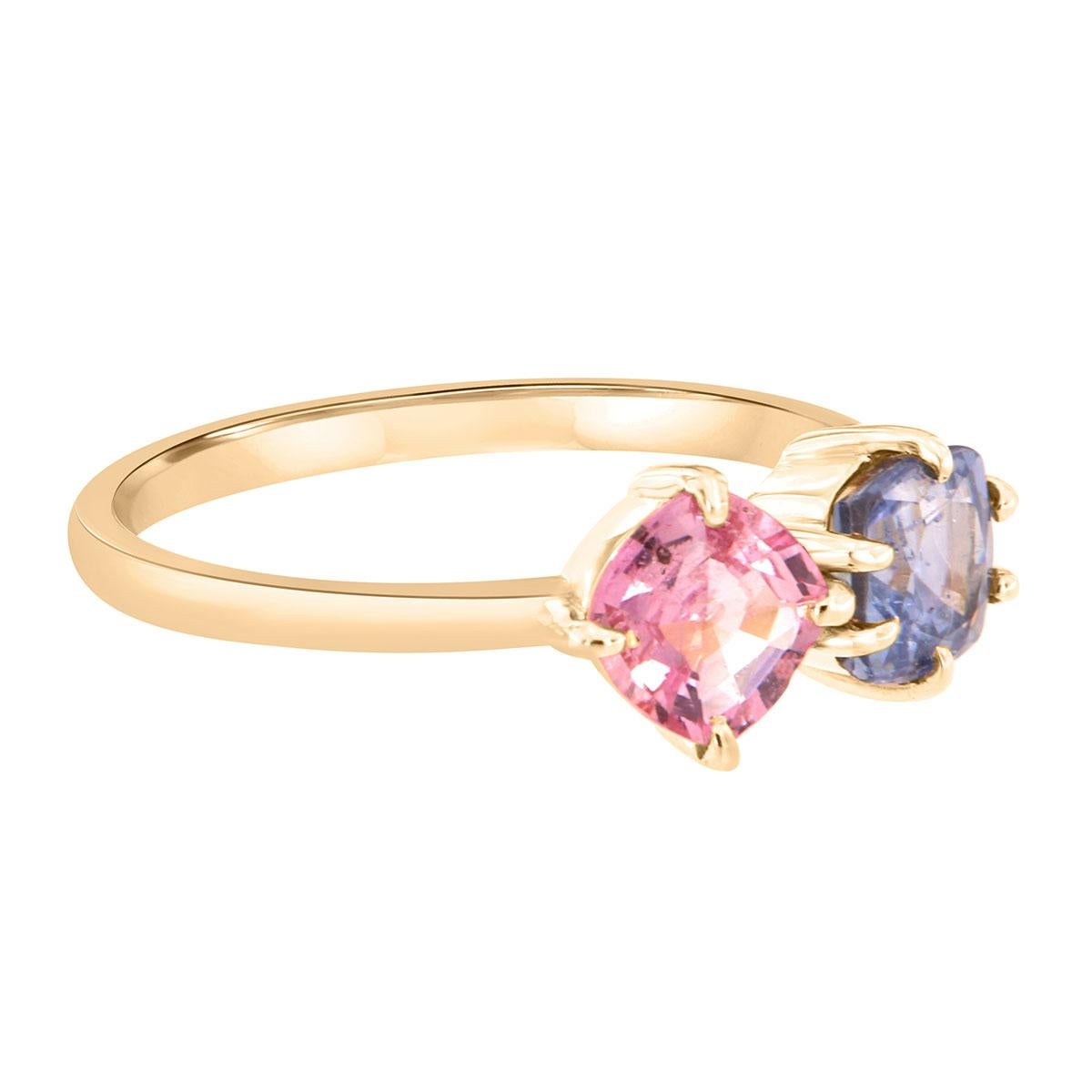 This One-Of-A-Kind 14k yellow gold ring features two natural unheated Sri-Lankan sapphires. Both sapphires exhibit excellent luster. The pink sapphire is cushion-shaped and  0.78 carats. The Blue Sapphire is a Cushion shape and weight of 0.97 Carat.
