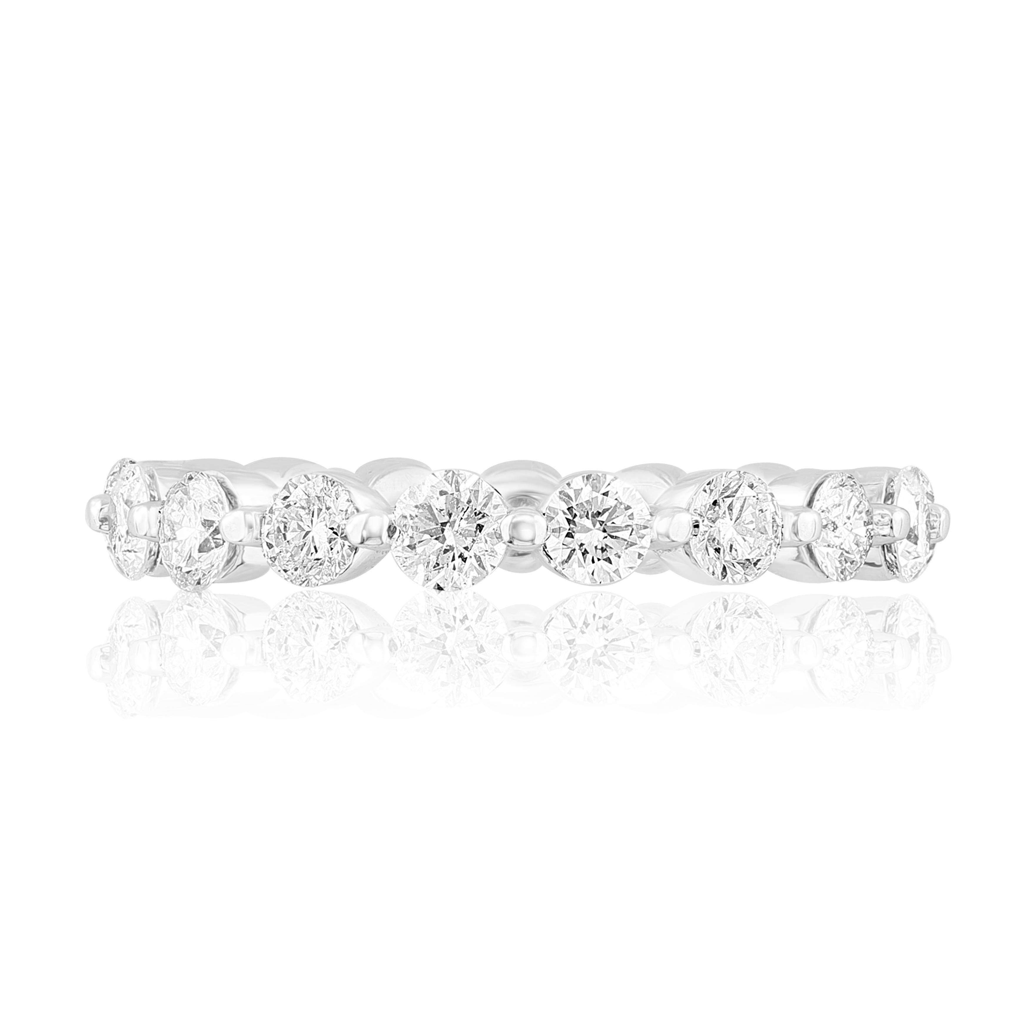 A classic and timeless eternity band style showcasing a row of round brilliant diamonds set in a shared prong 14K white gold mounting. 17 Diamonds weigh 1.75 carats. Size 6.5 US.

Style is available in different price ranges. Prices are based on