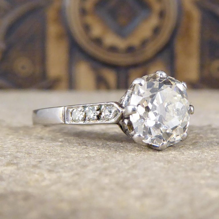 This absolutely out of this world ring was hand crafted in the Art Deco period. Made fully from Platinum with small Diamond set shoulders, this gorgeous ring holds a 1.75ct Cushion Cut Diamond. It has an exquisite gallery with lovely detailing and