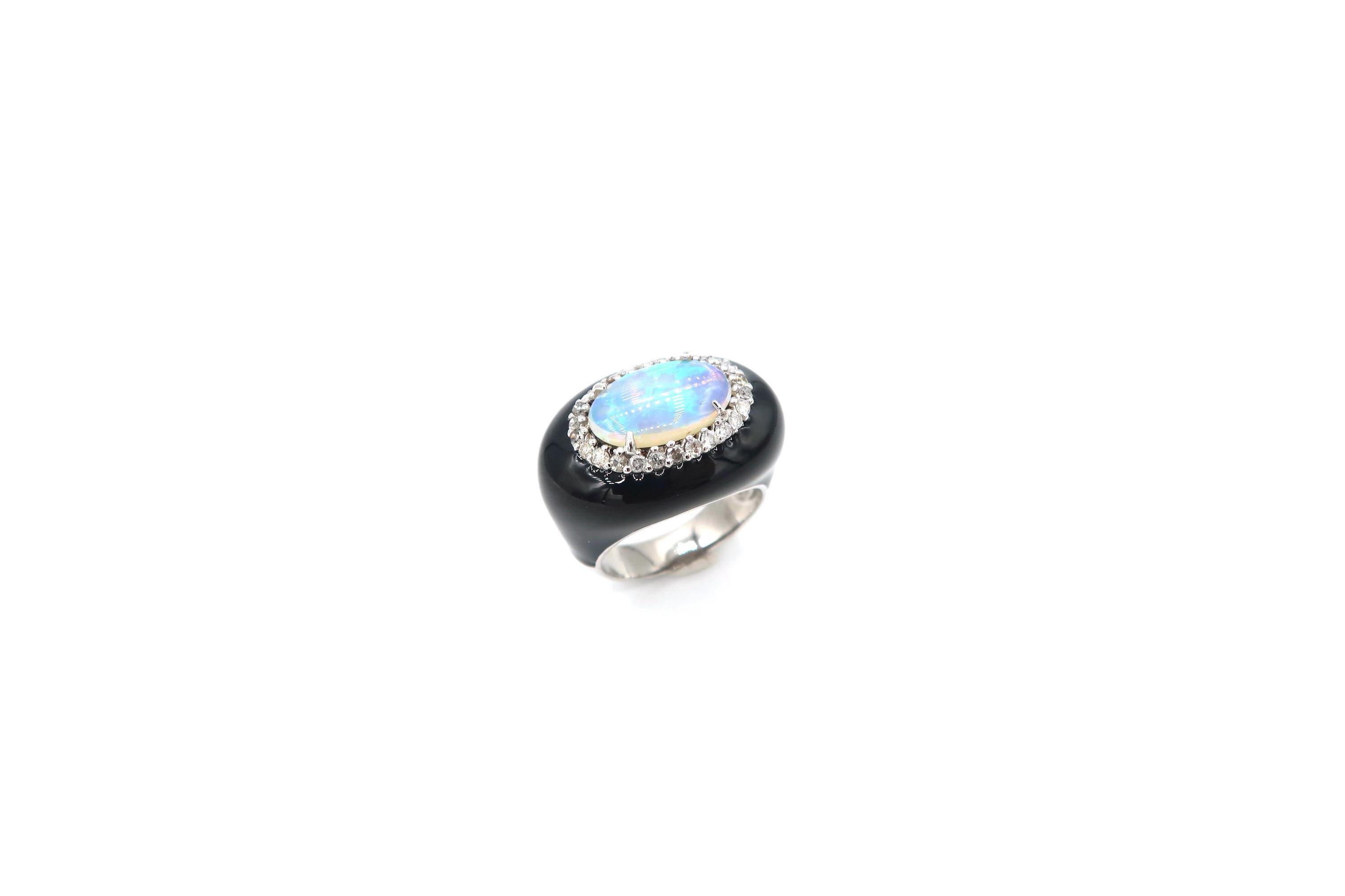 1.75 Carat Oval Opal Surrounded by Diamond Black Enamel Oval Shaped Ring in 18K Gold

Opal: 1.75ct.
Diamond: 0.54ct.
Gold: 18K 12.16g.

Ring size: 52.5
Please let us know should you wish to have the ring resized.
