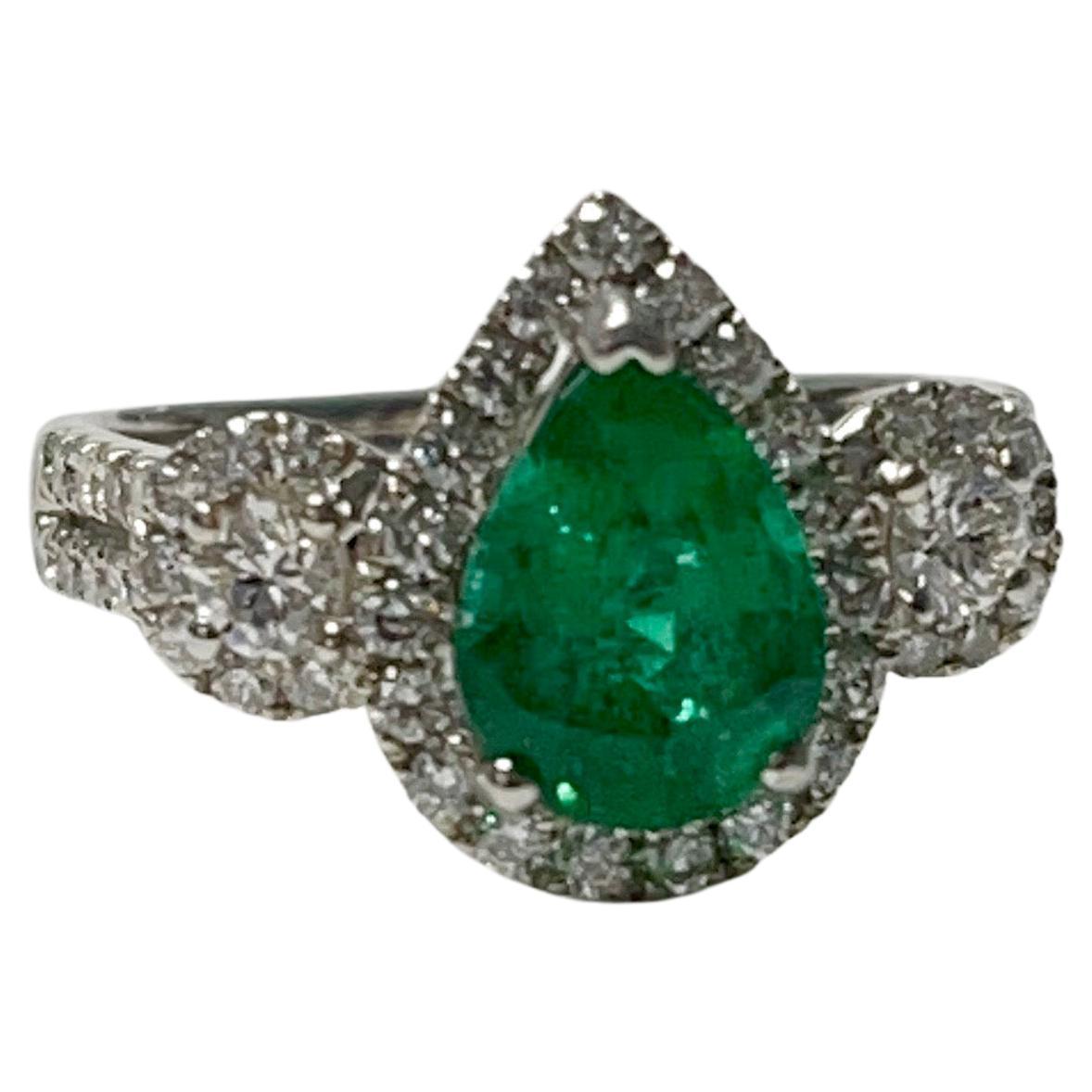 Gorgeous pear shape emerald and diamond ring in 18k white gold. 
The details are as follows: 
Emerald weight : 1.75 carat
Diamond weight : 0.64 carat ( GH color and VS clarity ) 
Metal : 18k white gold 
measurements : ring head : 13.3mm 
