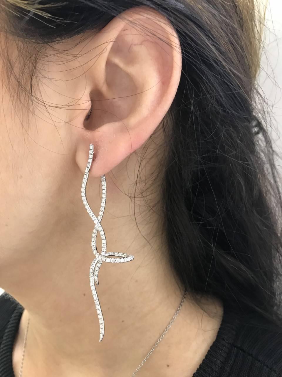 Delicate 18 Karat White Gold Swirls create these enchanting 1.75 Carat Diamond Earrings color H clarity SI. Elegantly crafted into smooth contours and encrusted with luminous White Round Brilliant Diamonds. British Hallmarked. Available in Rose and