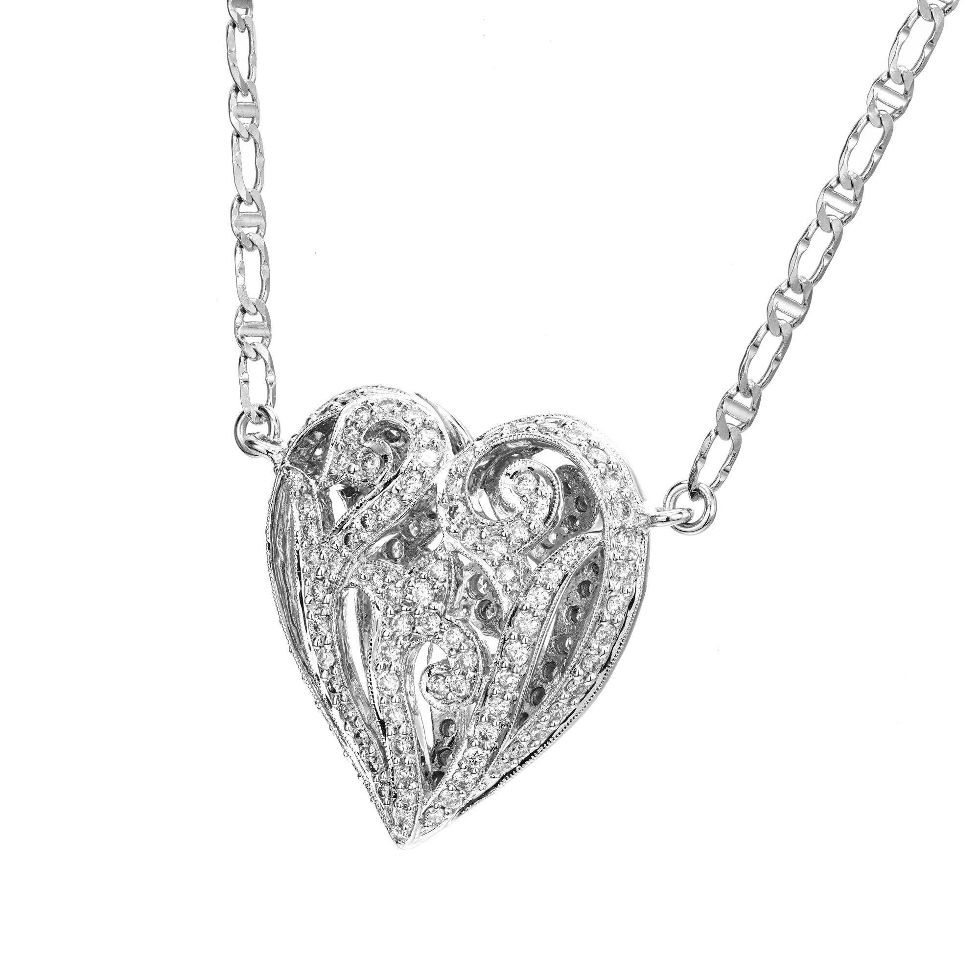 1970's Captivating diamond heart pendant necklace. This stunning puffed, dome heart shaped, cut out pendant is adorned with 196 pave set round brilliant cut diamonds totaling 1.75cts. The front and back of the pendant are identical. Made in 14k