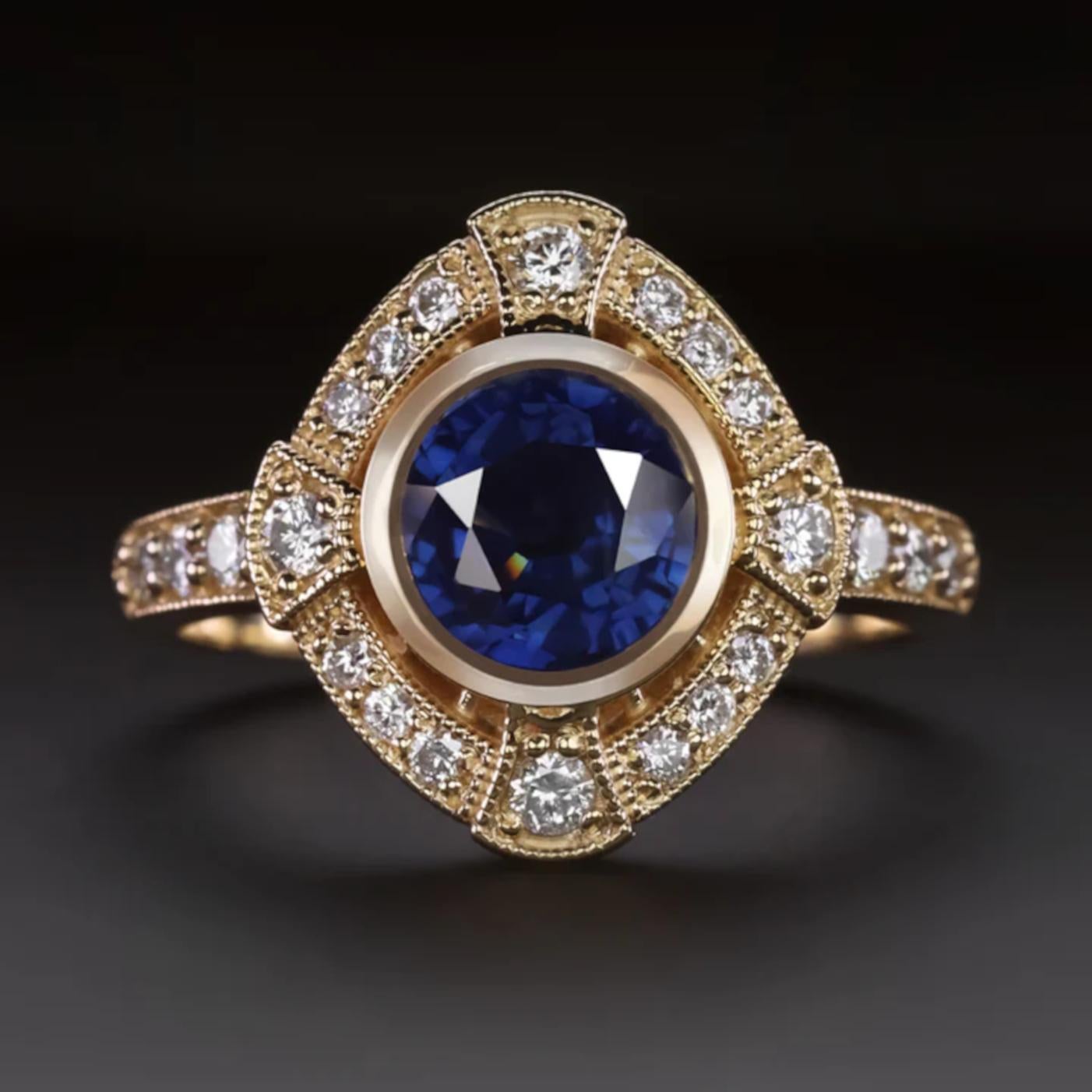 Sapphire and diamond cocktail ring.
The main stone is a rich blue sapphire surrounded by an halo of diamonds! 
The Art Deco style setting is made in solid 14k yellow gold.

- 1.75ct natural sapphire

- 0.37ct accent diamonds