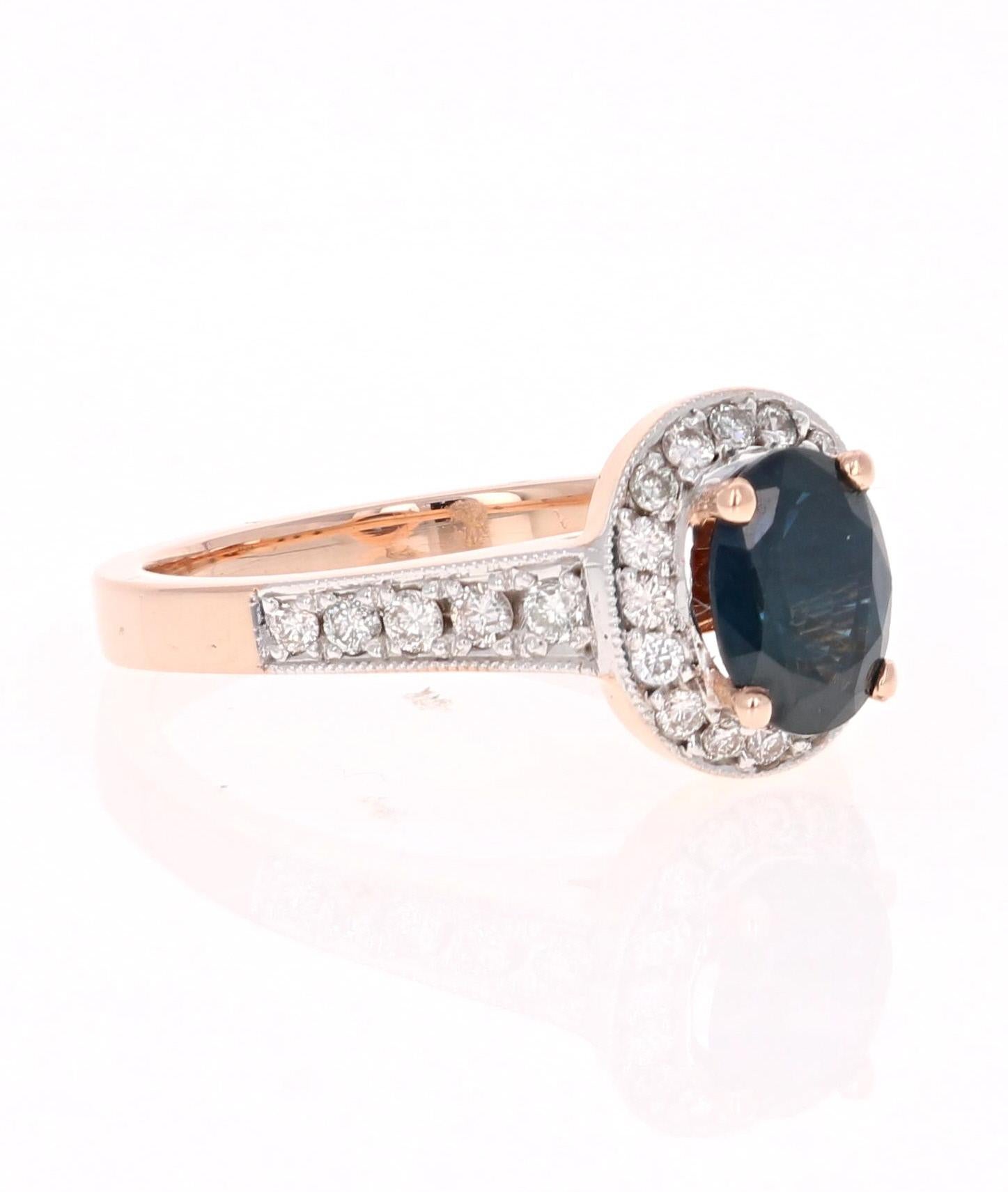 Beautiful Blue Sapphire and Diamond Ring!  This ring has a Oval Cut Sapphire set in the center of the ring that weighs 1.35 Carats. It is surrounded by 26 Round Cut Diamonds that weigh 0.40 Carats.The total carat weight of the ring is 1.75 carats.