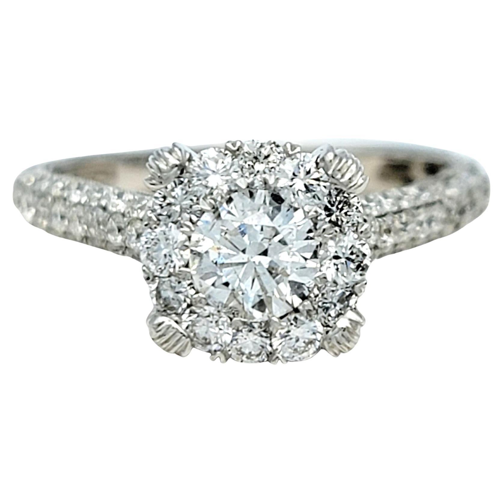 Ring size 7.5

Experience the epitome of elegance with this stunning diamond engagement ring, a dazzling testament to everlasting love and timeless beauty. At its heart, a brilliant .65 carat round diamond takes center stage, capturing and
