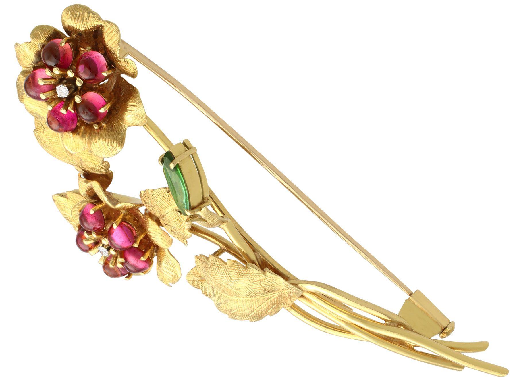 An impressive vintage 1.75 carat tourmaline and 0.06 carat diamond, 18 karat yellow gold spray brooch by 'Liberty'; part of our diverse vintage jewelry collections

This fine and impressive vintage floral brooch has been crafted in 18k yellow