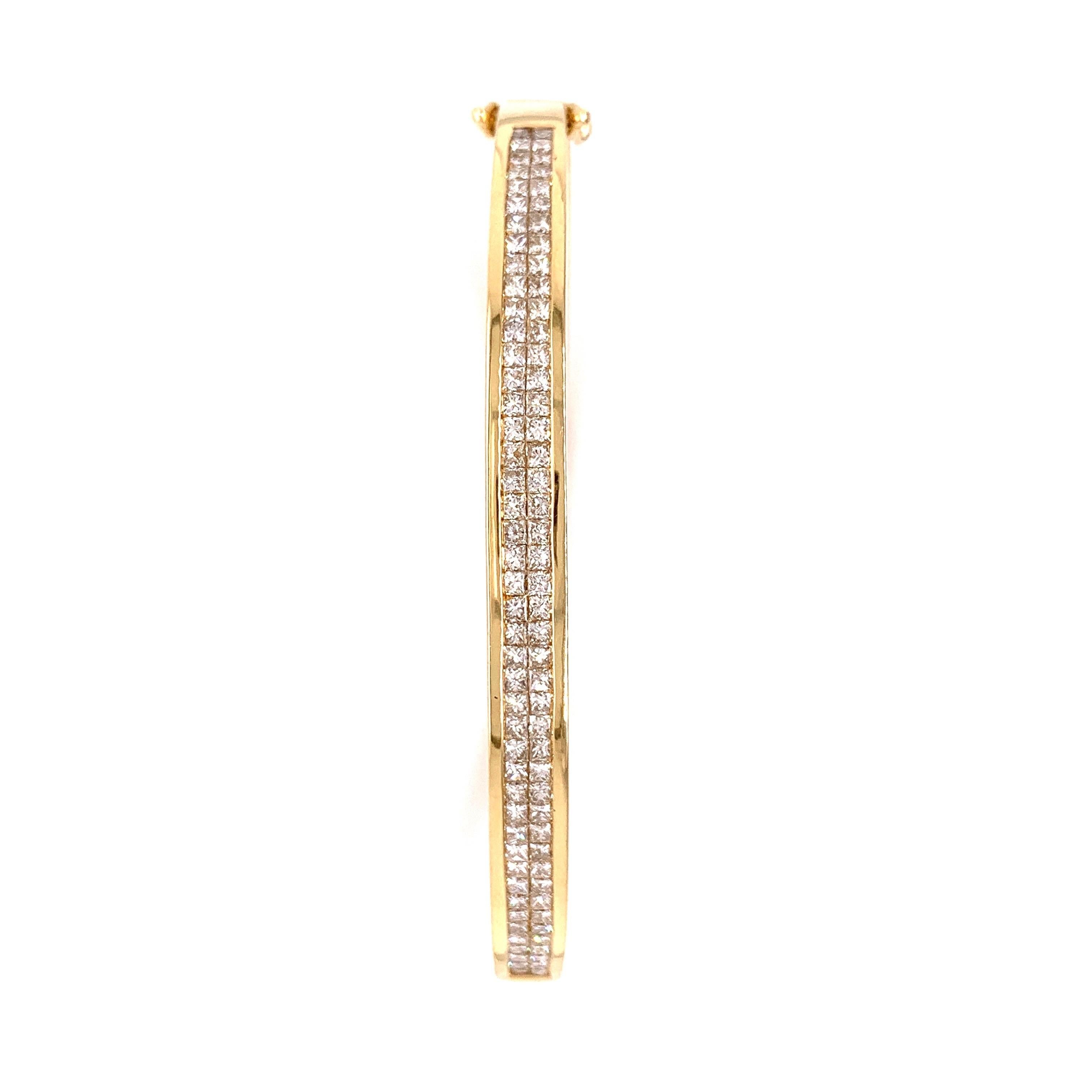 Elegant diamond bangle. Sparkling two rows of princess cut diamonds in hand-crafted 14 karats high polished yellow gold with tapered box clasp and safety catch. 

Diamond: 1.75 carats, princess cut
colour: I-J
Clarity: SI1-I1
Dimensions: 5.1/5cm x