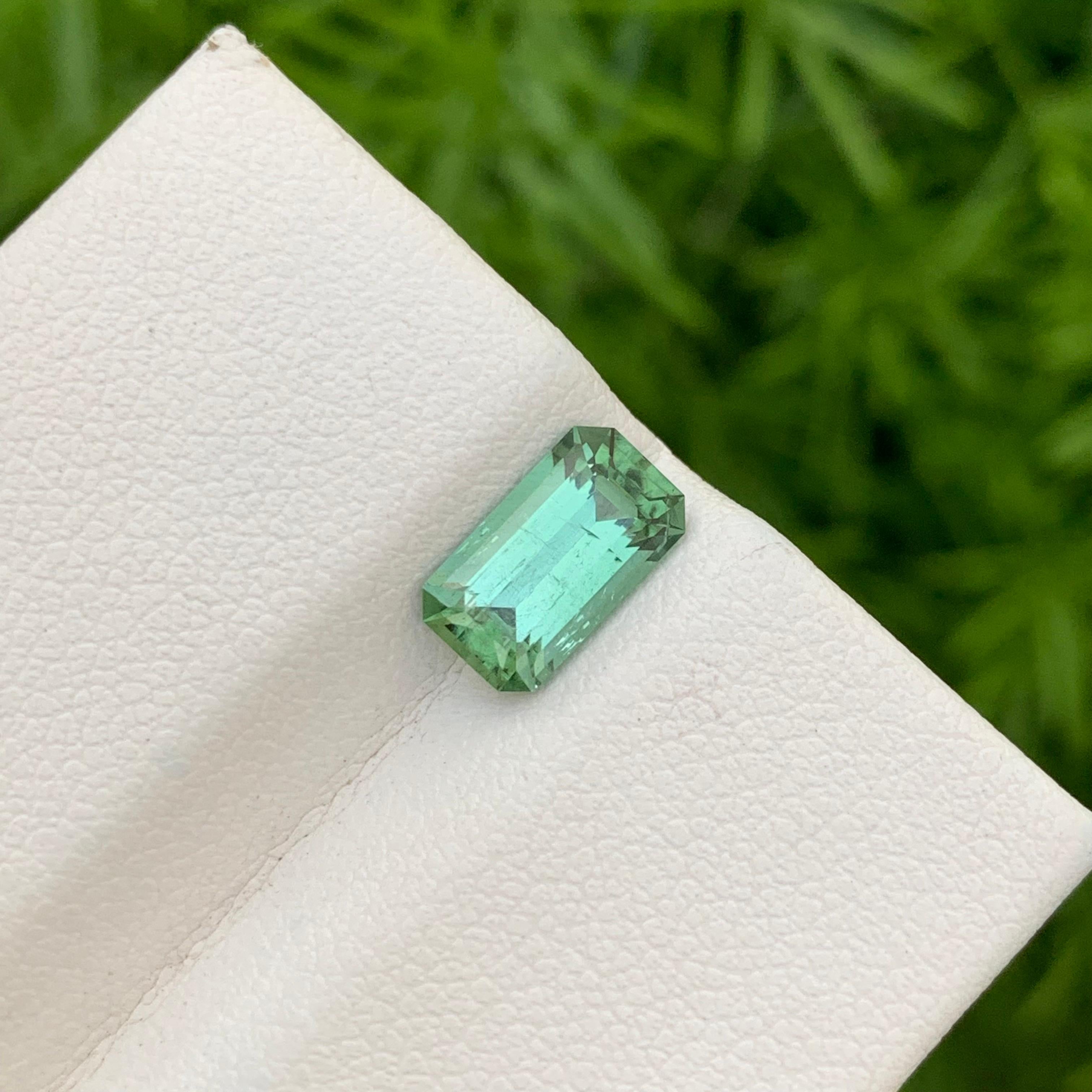 Faceted Tourmaline 
Weight: 1.75 Carats 
Dimension: 9.4x5.3x4.3 Mm
Origin: Kunar Afghanistan 
Shape: Emerald 
Color: Mint 
Treatment: Non
Certificate: On Demand
Mint green tourmaline, a captivating gemstone, possesses a unique allure that has