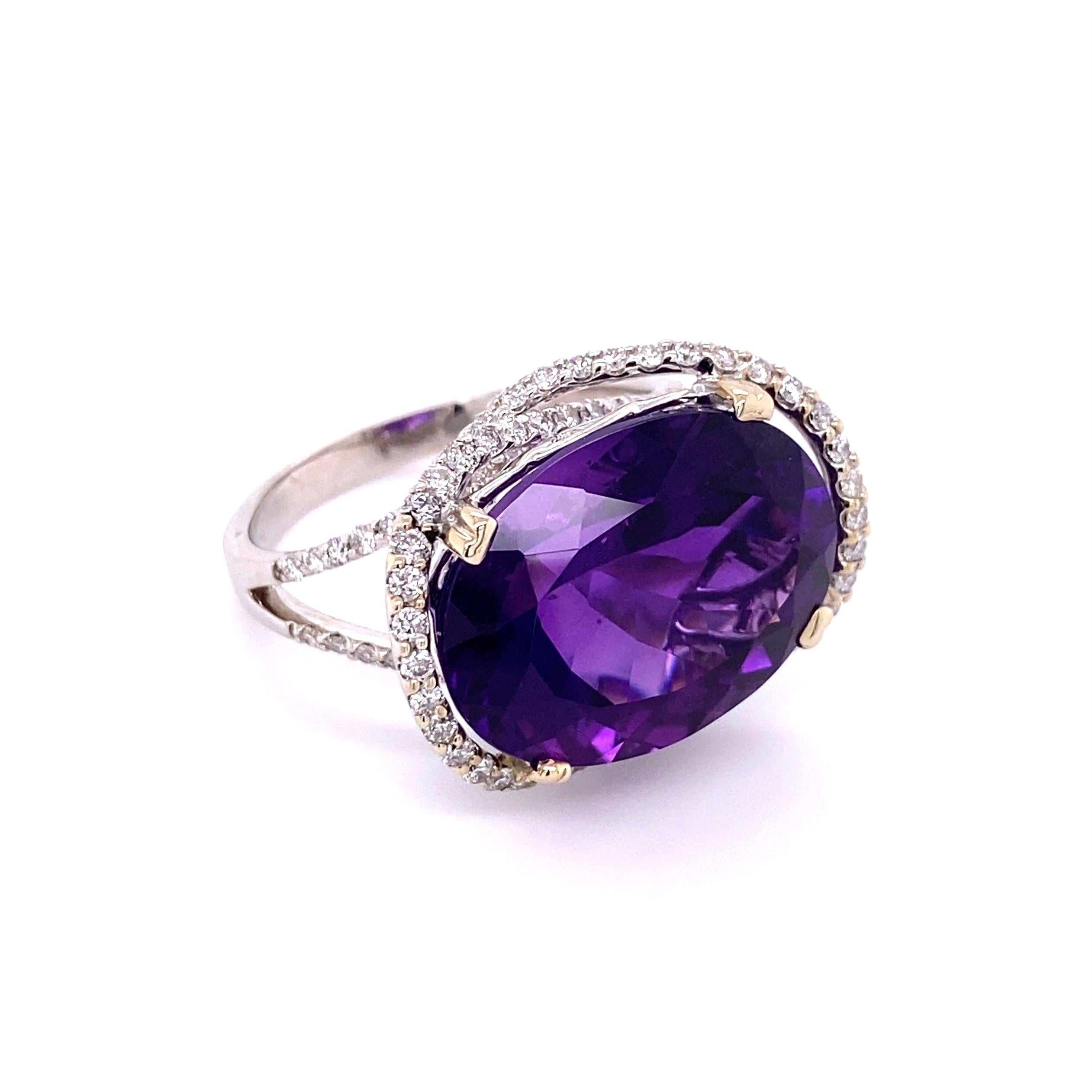 Simply Beautiful! Finely detailed Topaz and Diamond Art Deco Revival Cocktail Ring. Centering a Hand set securely nestled 17.50 Siberian Amethyst surrounded by Round Brilliant-Cut Diamonds, weighing approx. 1.52tcw including sides and on split